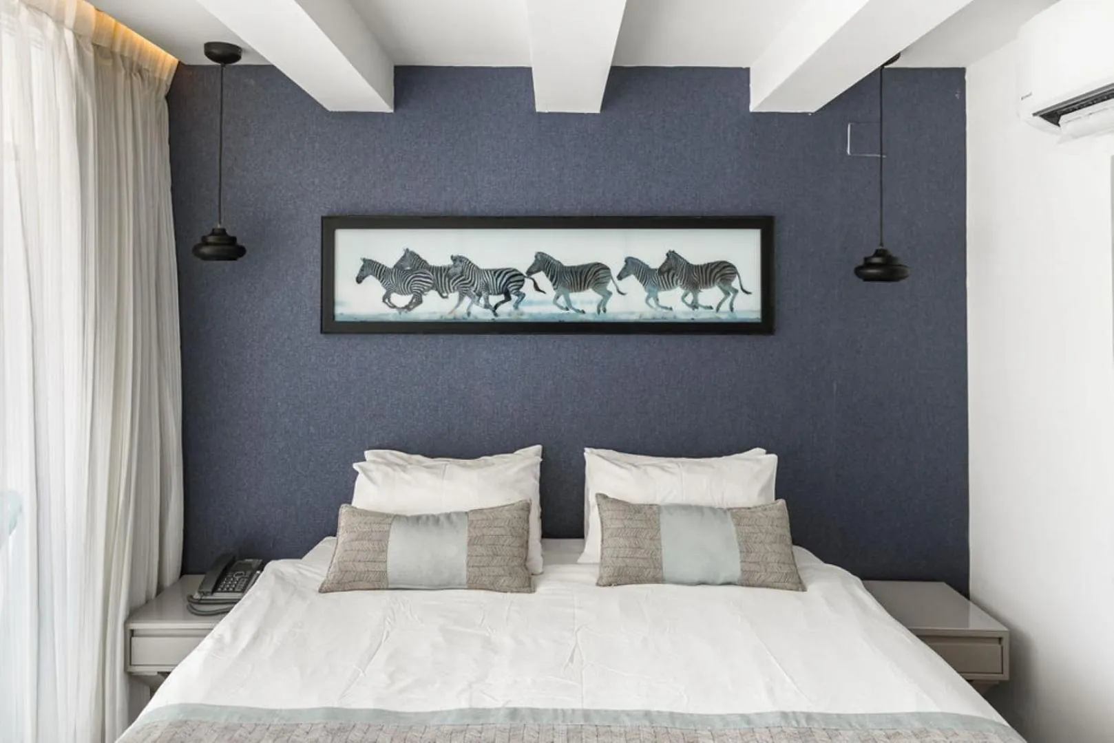 Bed in Kikar Boutique Hotel