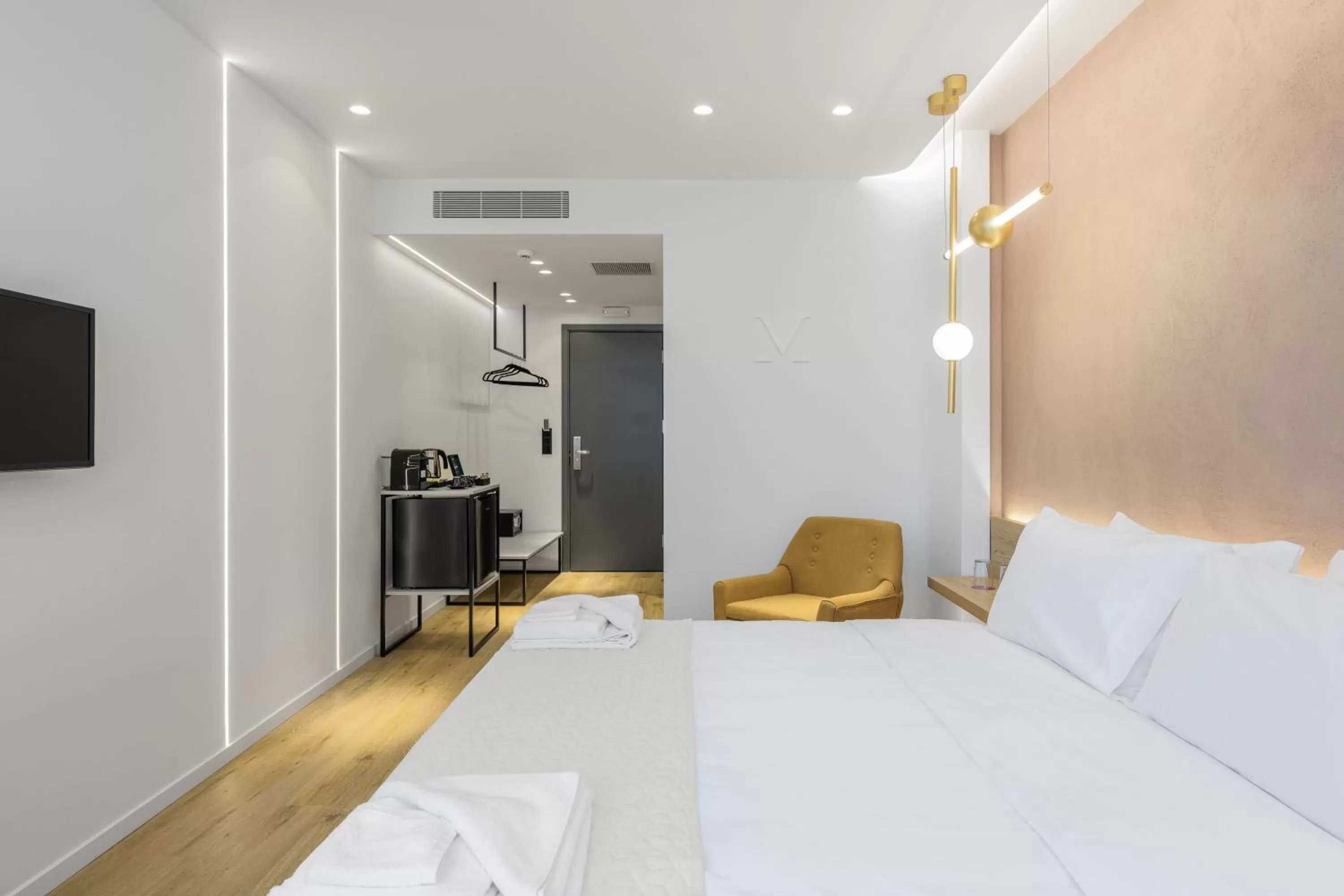 Bed in Acropolis Magenta Luxury Suites