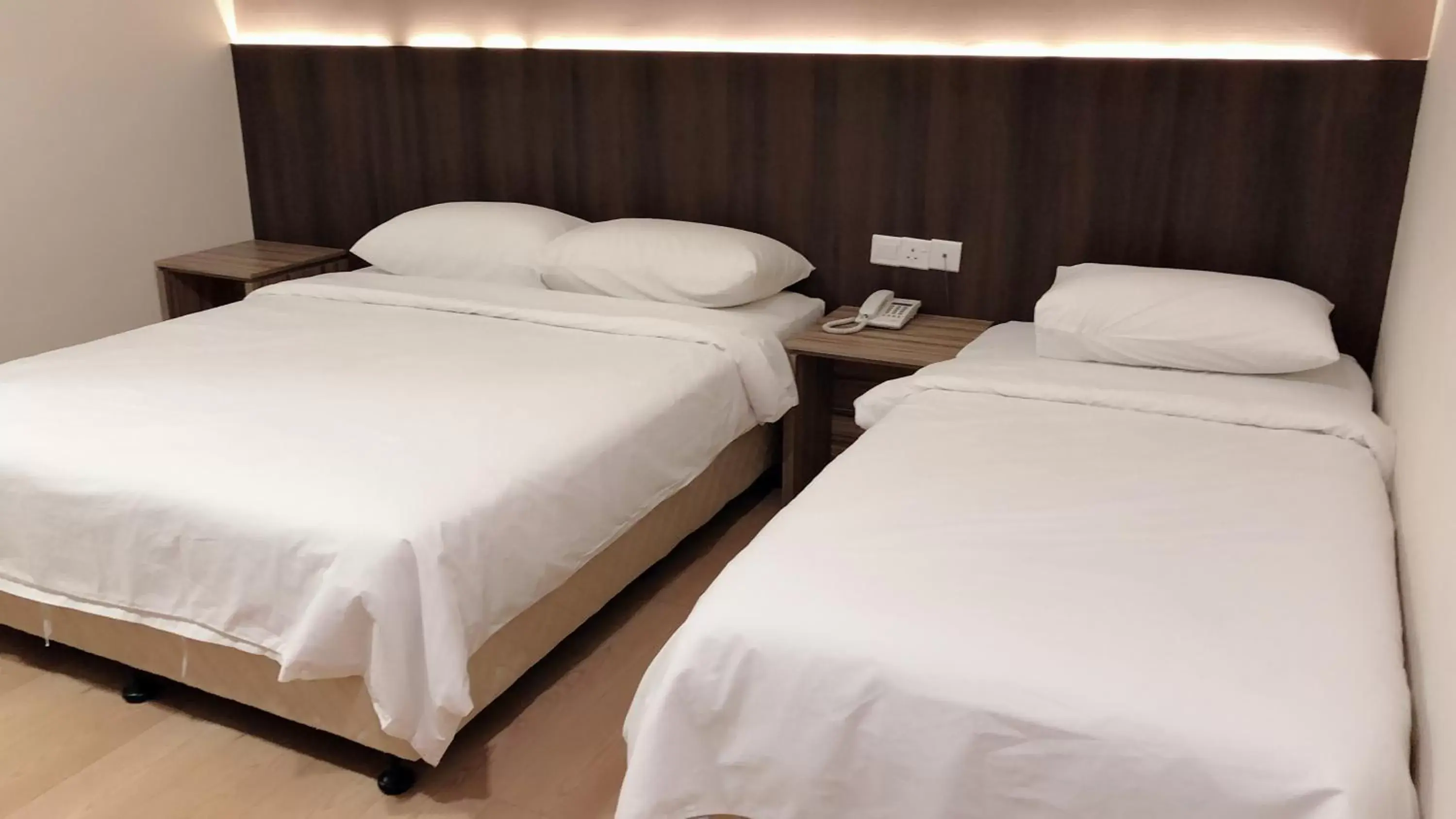 Bed in Tumike Hotel Bentong