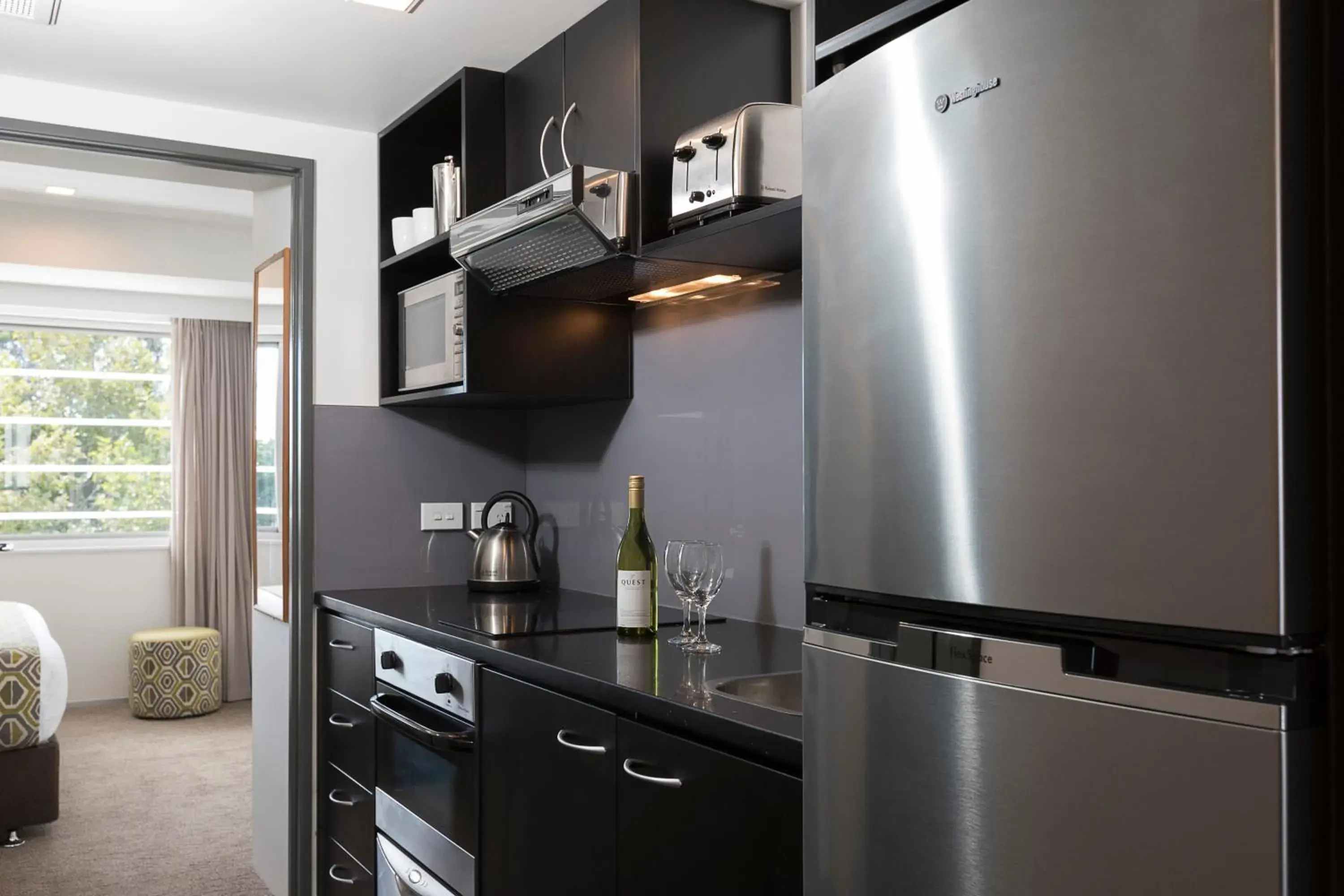 Bed, Kitchen/Kitchenette in Quest Ponsonby Serviced Apartments