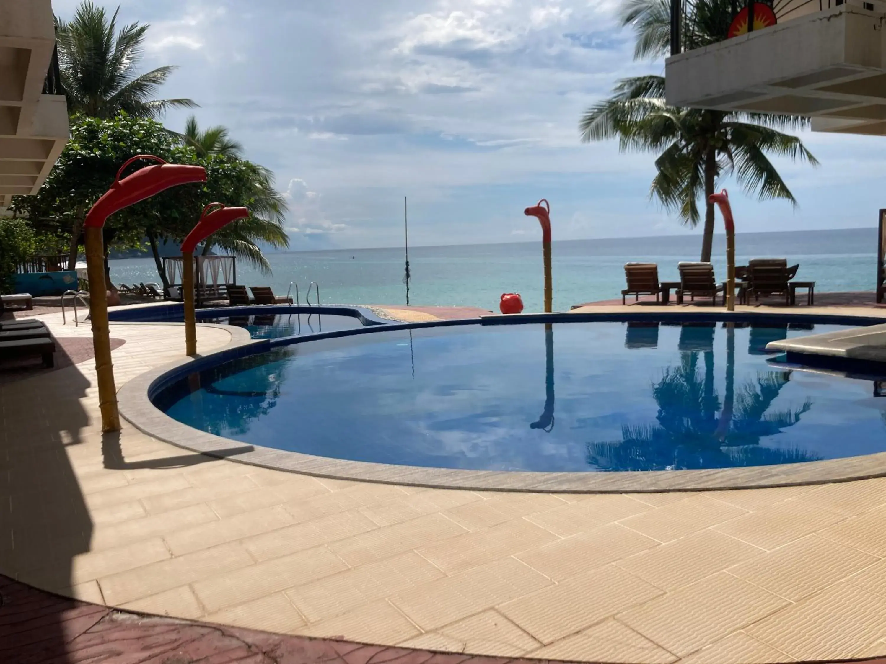 Pool view, Swimming Pool in Sunset At Aninuan Beach Resort