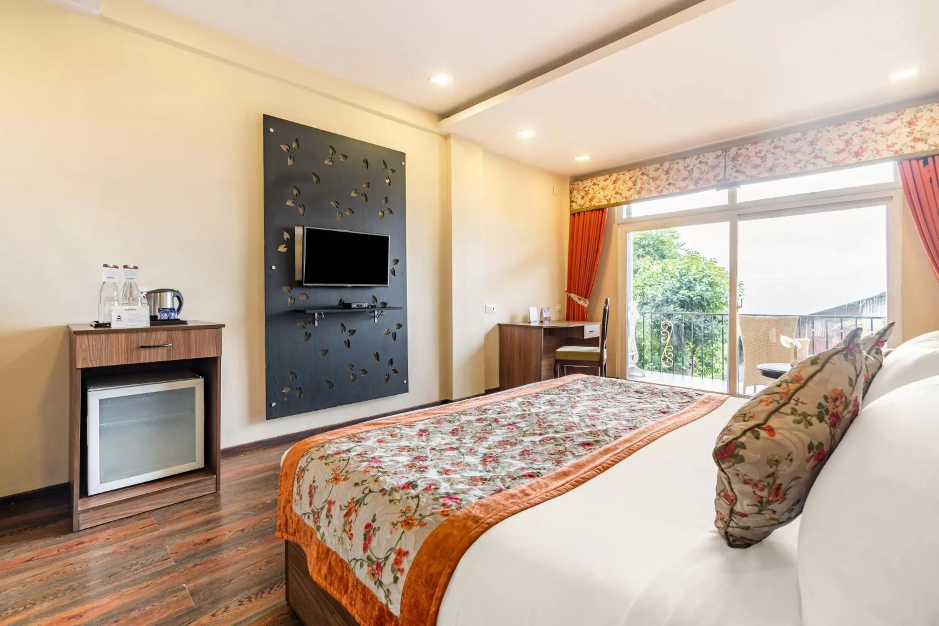 Bed, TV/Entertainment Center in Summit Barsana Resort & Spa