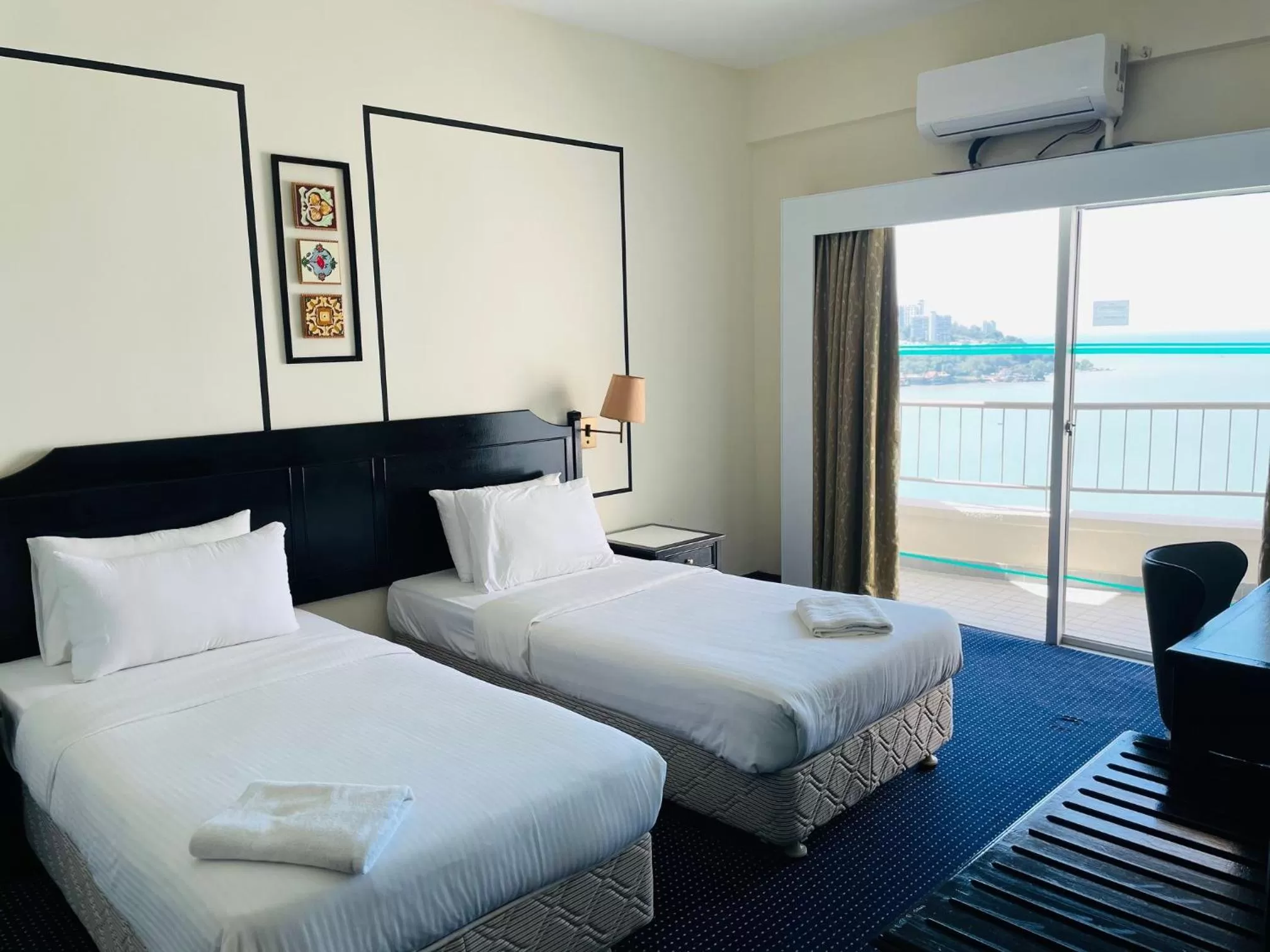 Bed in Seaview Suite at Rainbow Paradise
