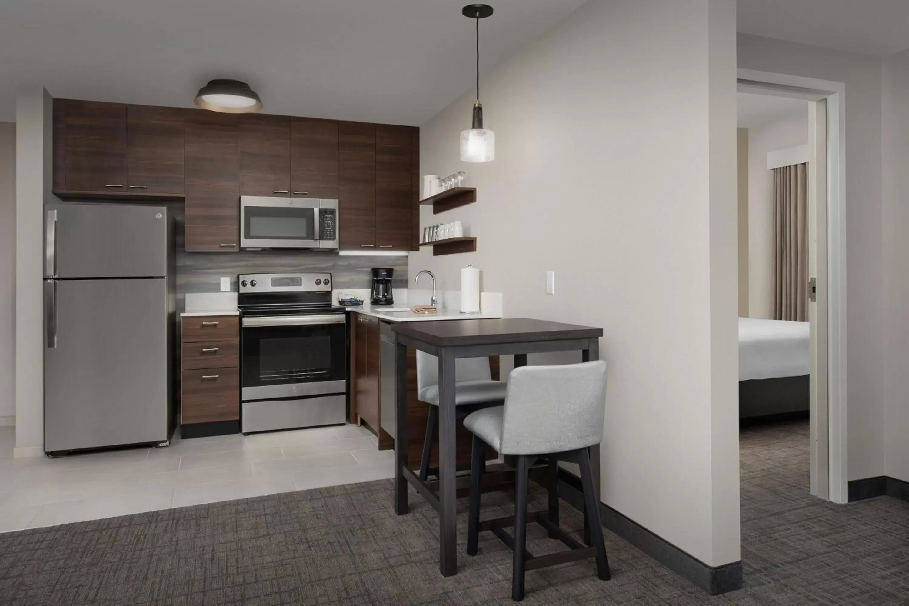 Bedroom, Kitchen/Kitchenette in Residence Inn by Marriott Jacksonville Downtown