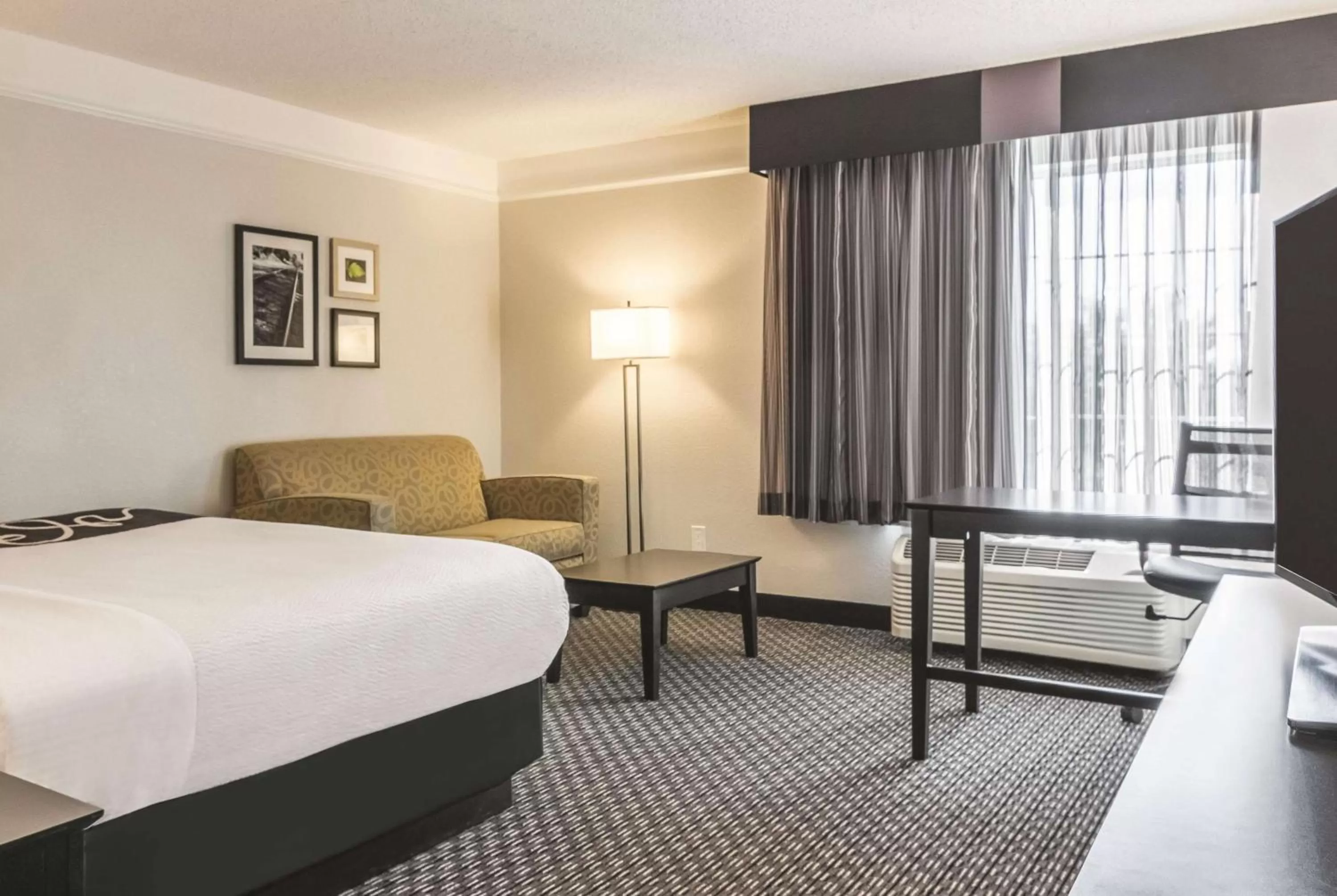 Photo of the whole room, Bed in La Quinta by Wyndham Orlando Airport North - Free Airport Shuttle!