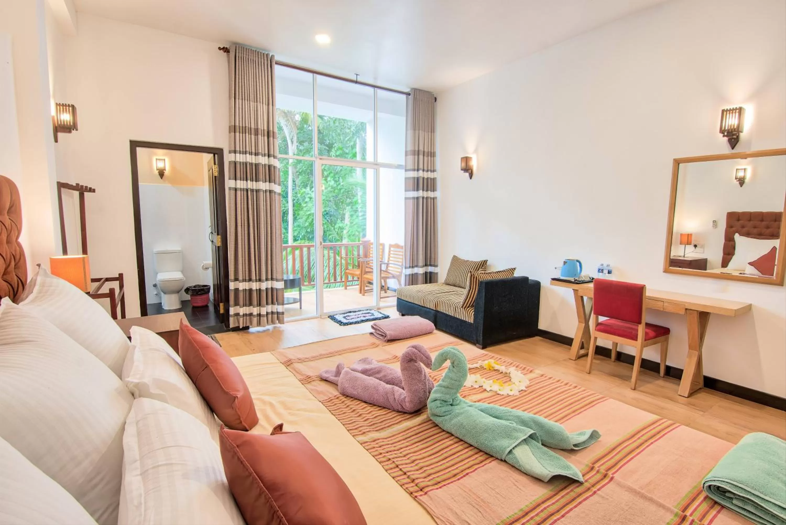 Bed, Seating Area in Ashiyana Hotel