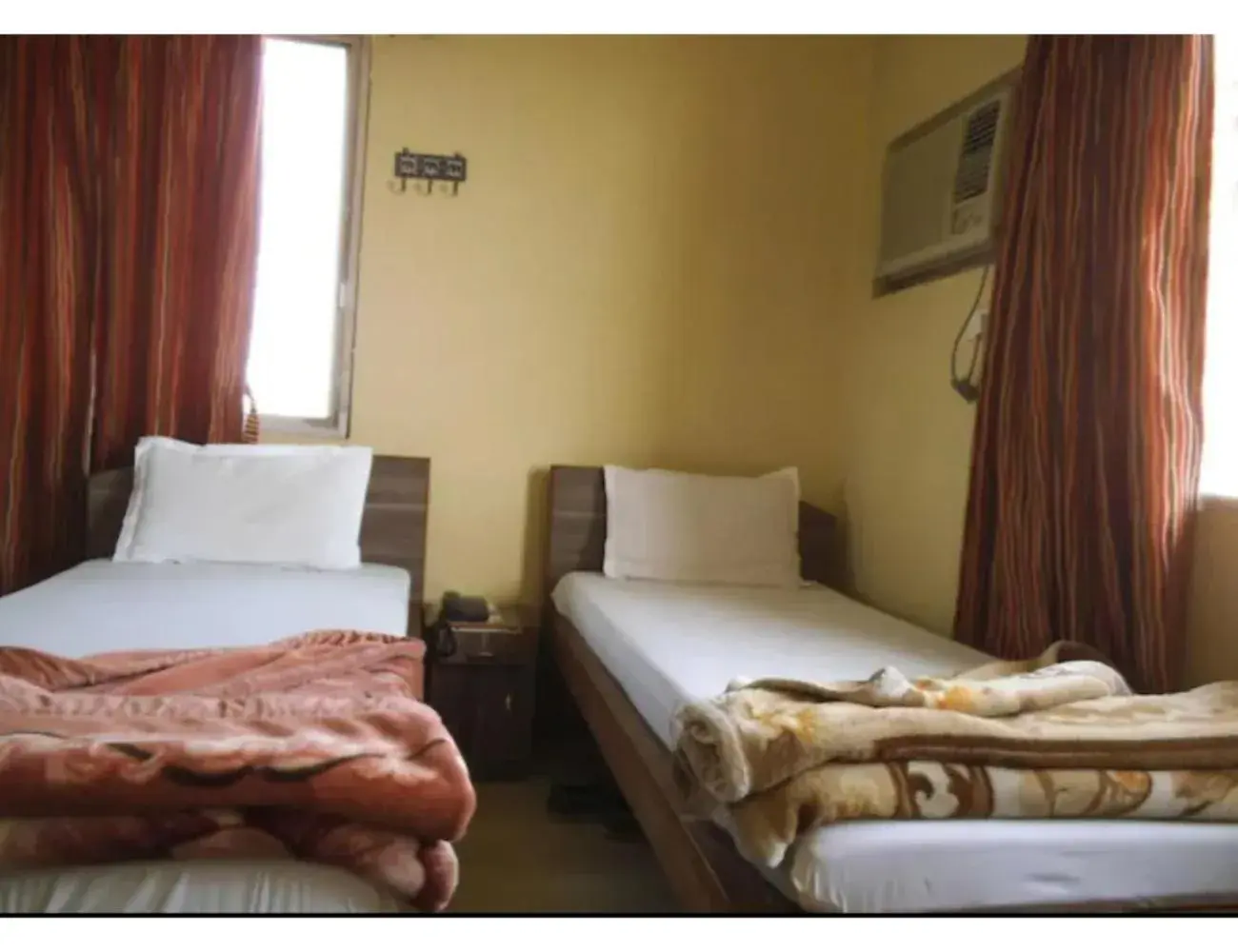 Bedroom, Bed in Goroomgo Central Guest House Agartala