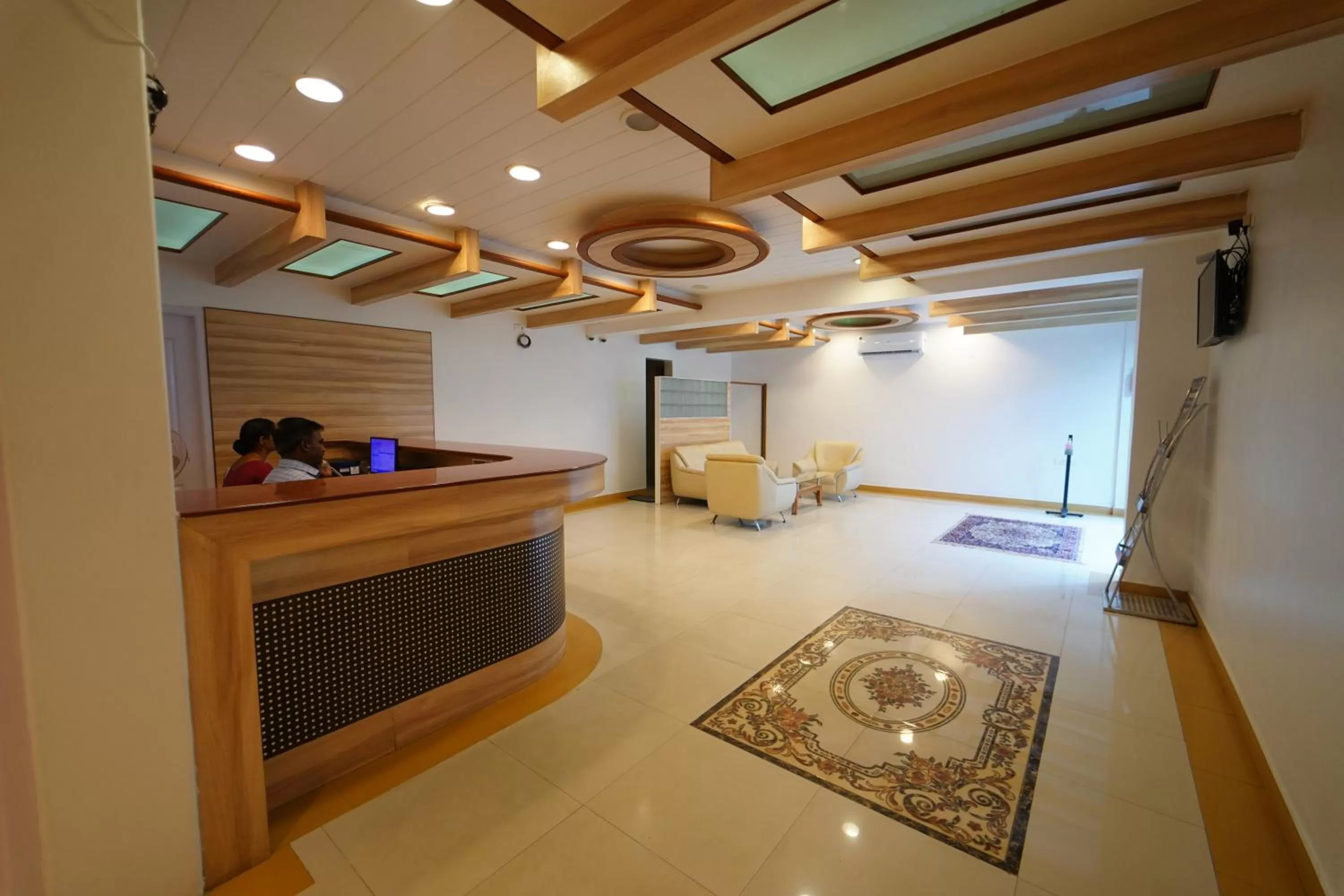 Lobby or reception in Hotel Palmyra Grand Inn