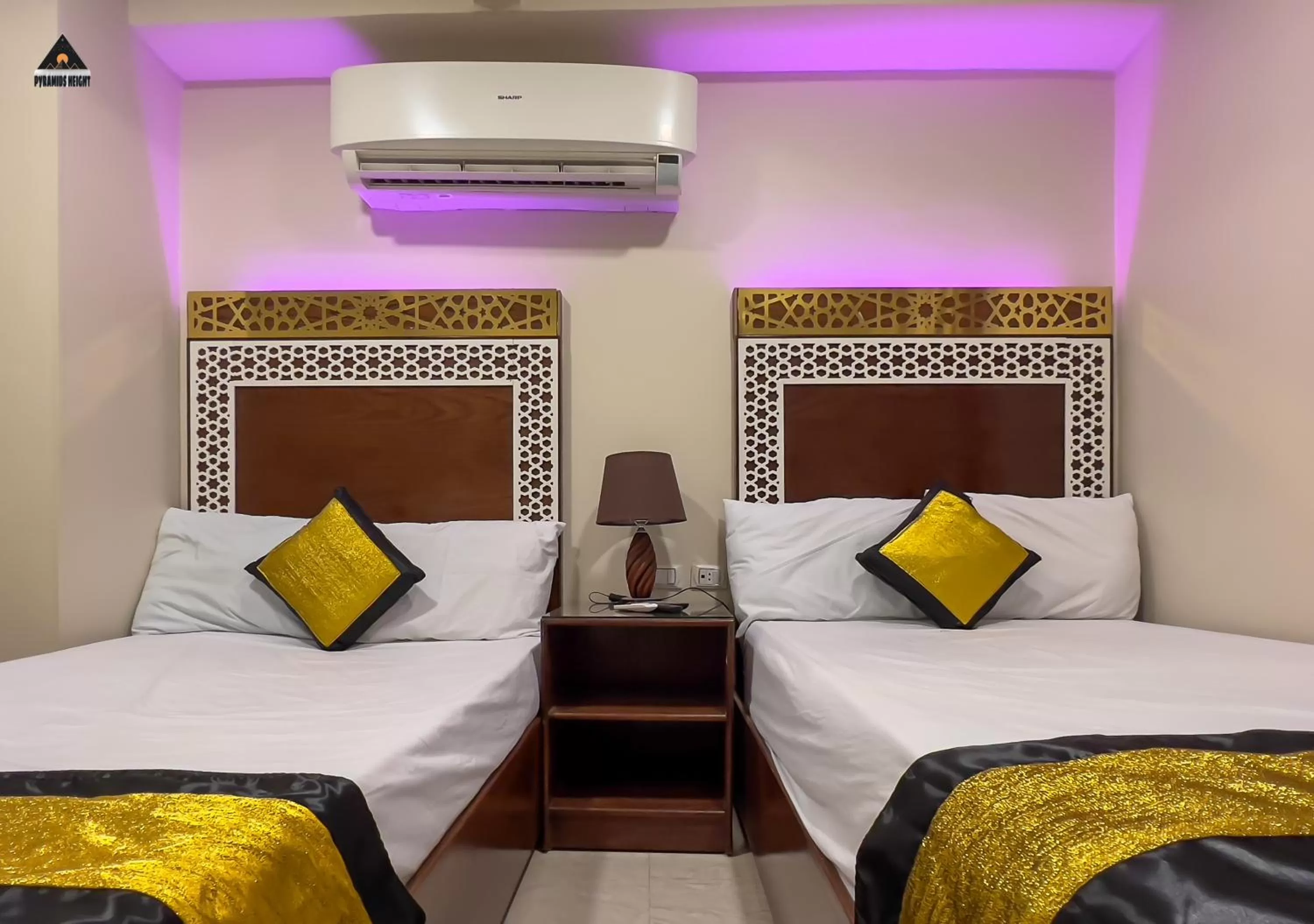 Bed in Pyramids Height Hotel & Pyramids Master Scene Rooftop