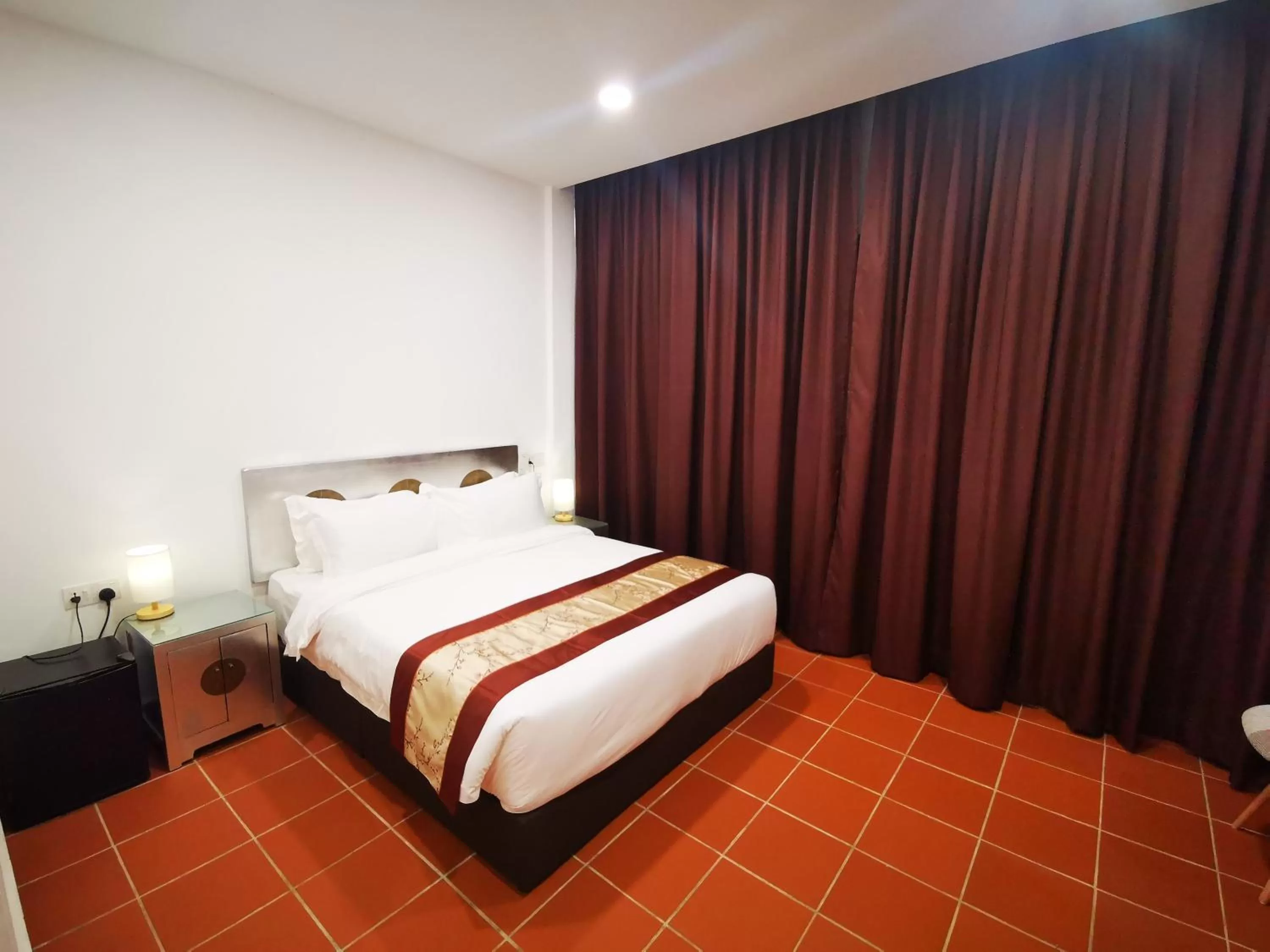 Bed in Mclane Boutique Hotel