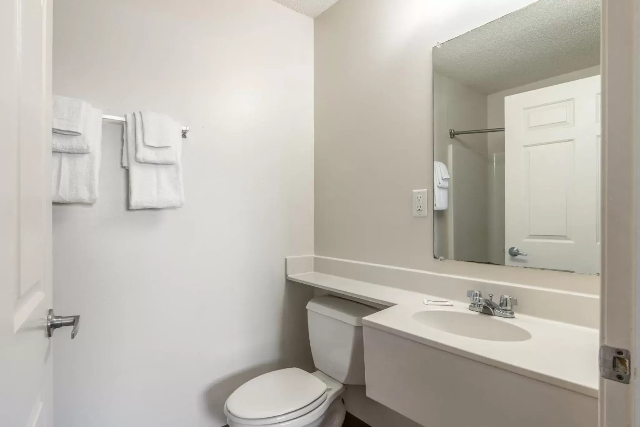 Bathroom in HomeTowne Studios & Suites by Red Roof Charlotte - Concord
