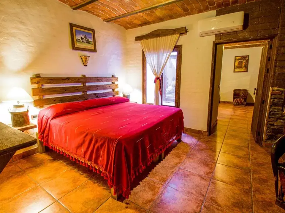 Bed in Hotel Mi Pueblito by Rotamundos