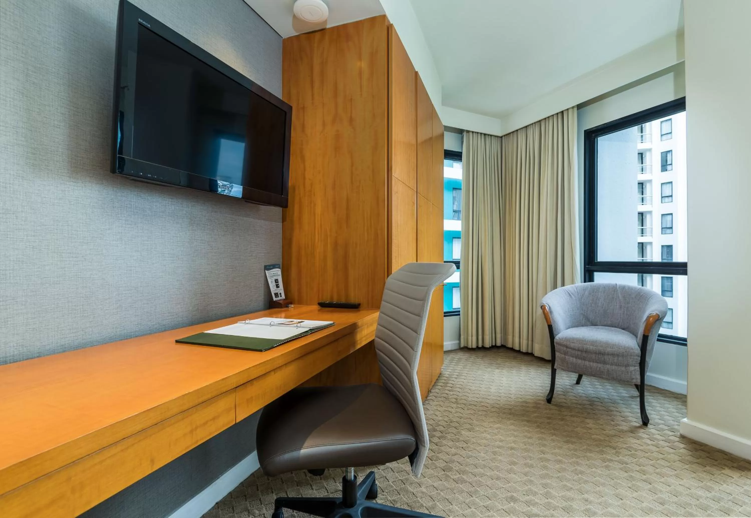 Communal lounge/ TV room in Chatrium Sathon Bangkok