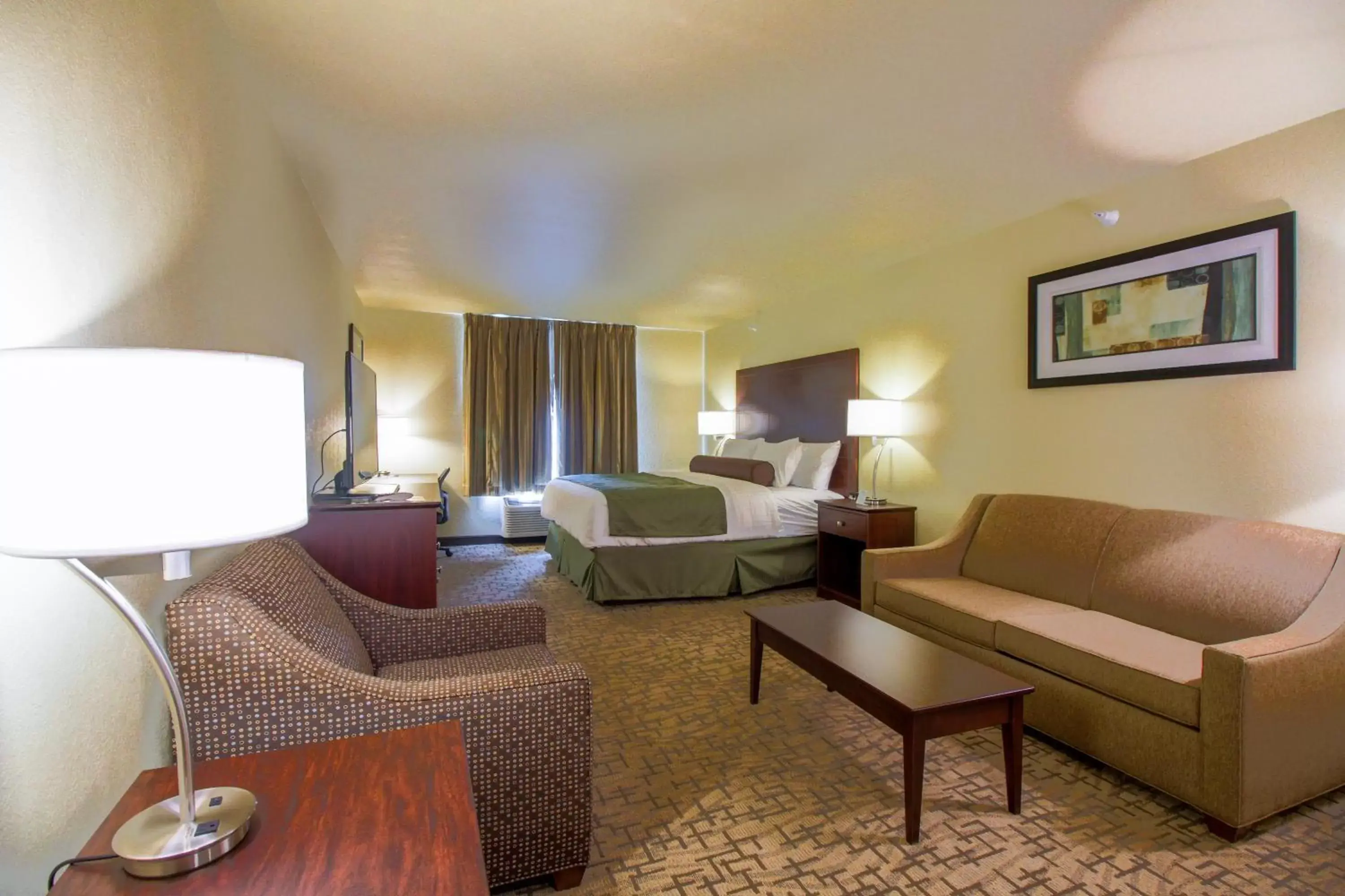 Bedroom, Seating Area in Cobblestone Hotel & Suites - Devils Lake