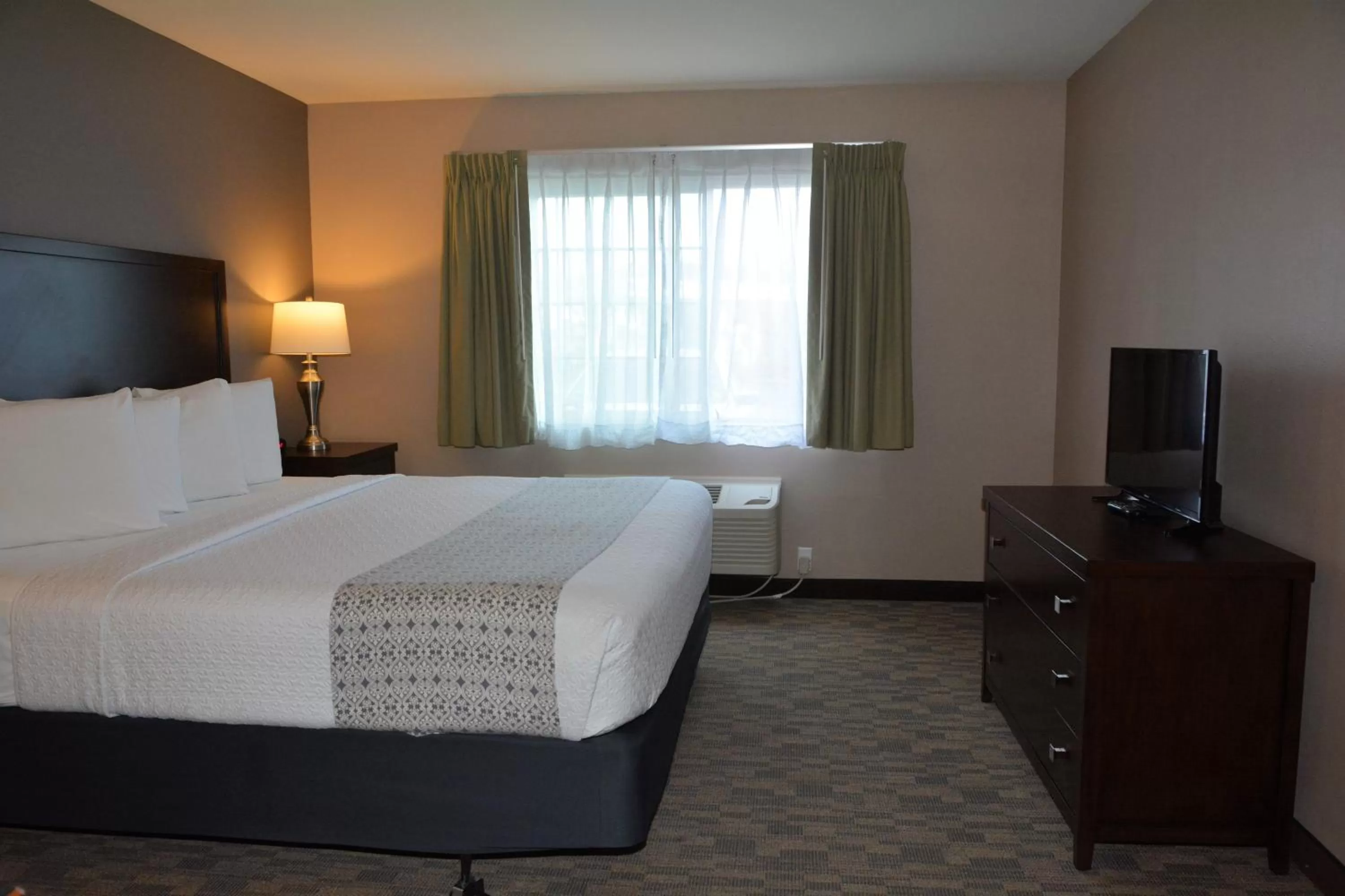 Bed in FairBridge Inn & Suites DuPont
