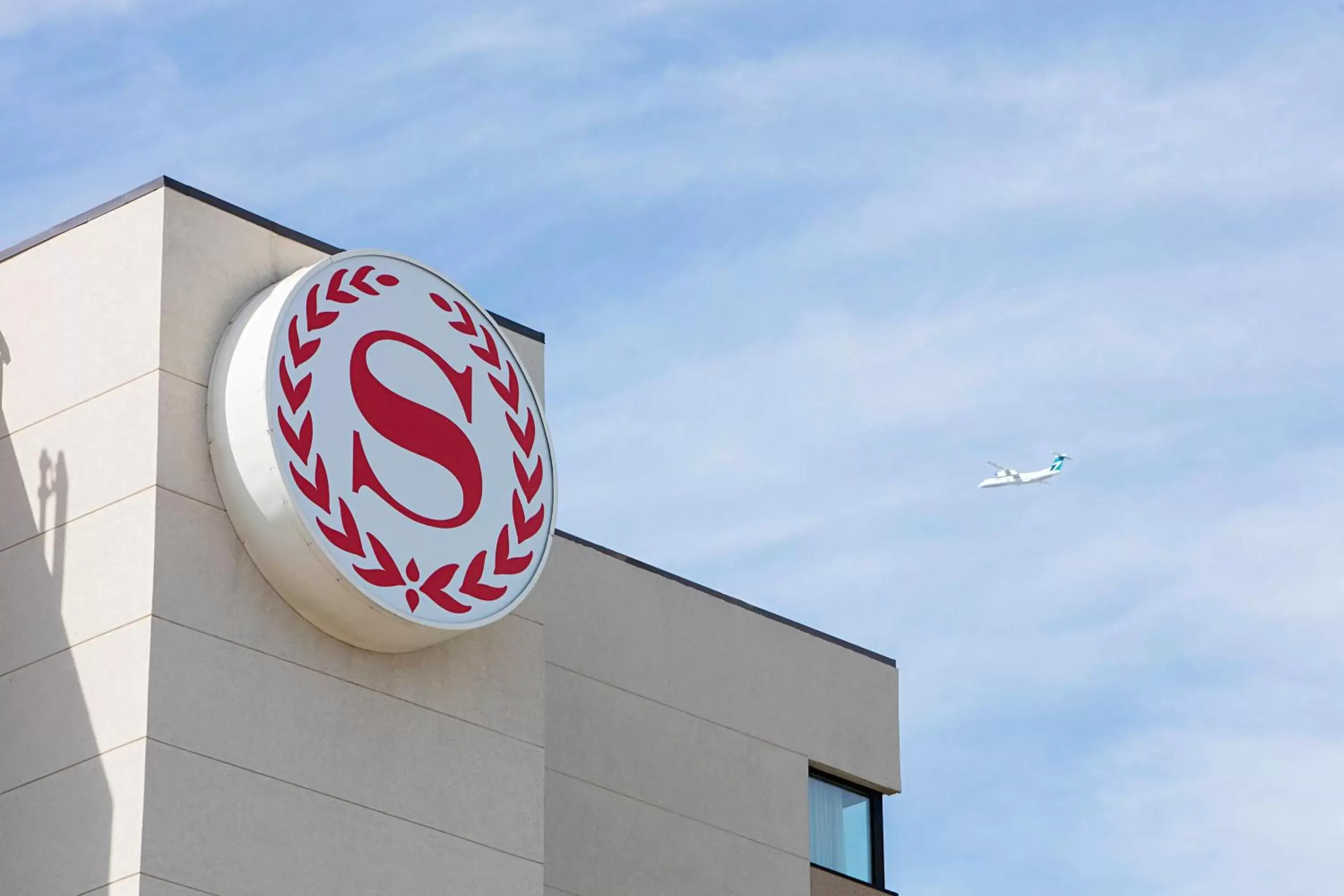 Property building, Property Logo/Sign in Sheraton Cavalier Calgary Hotel