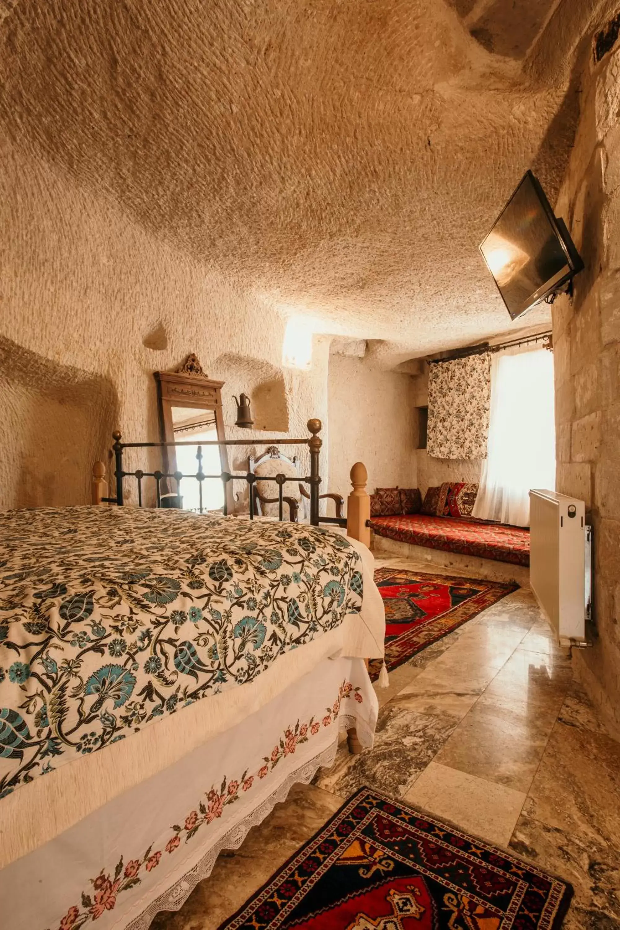 Bed in Village Cave House Hotel