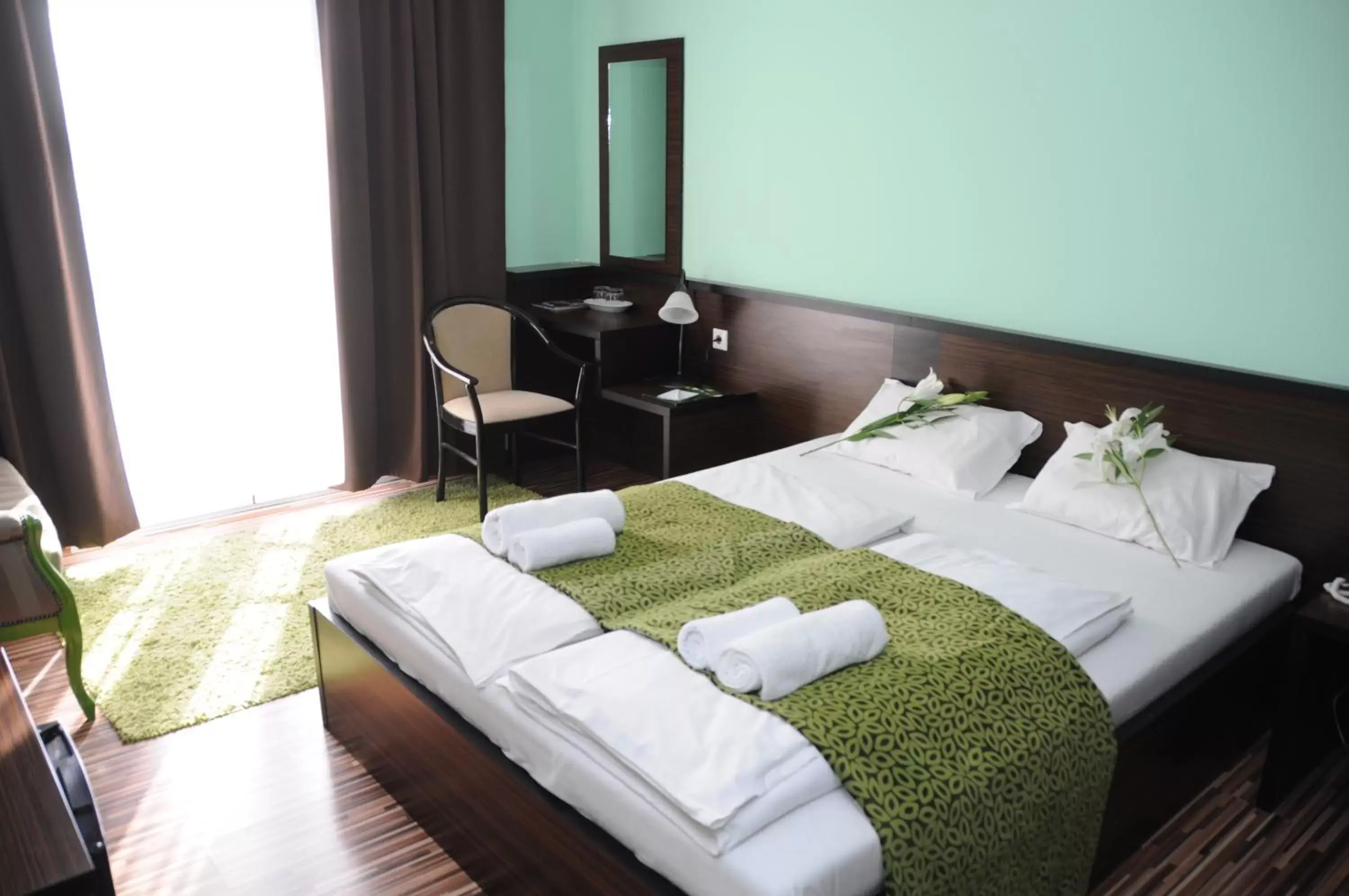 Bed in Green Hotel Budapest
