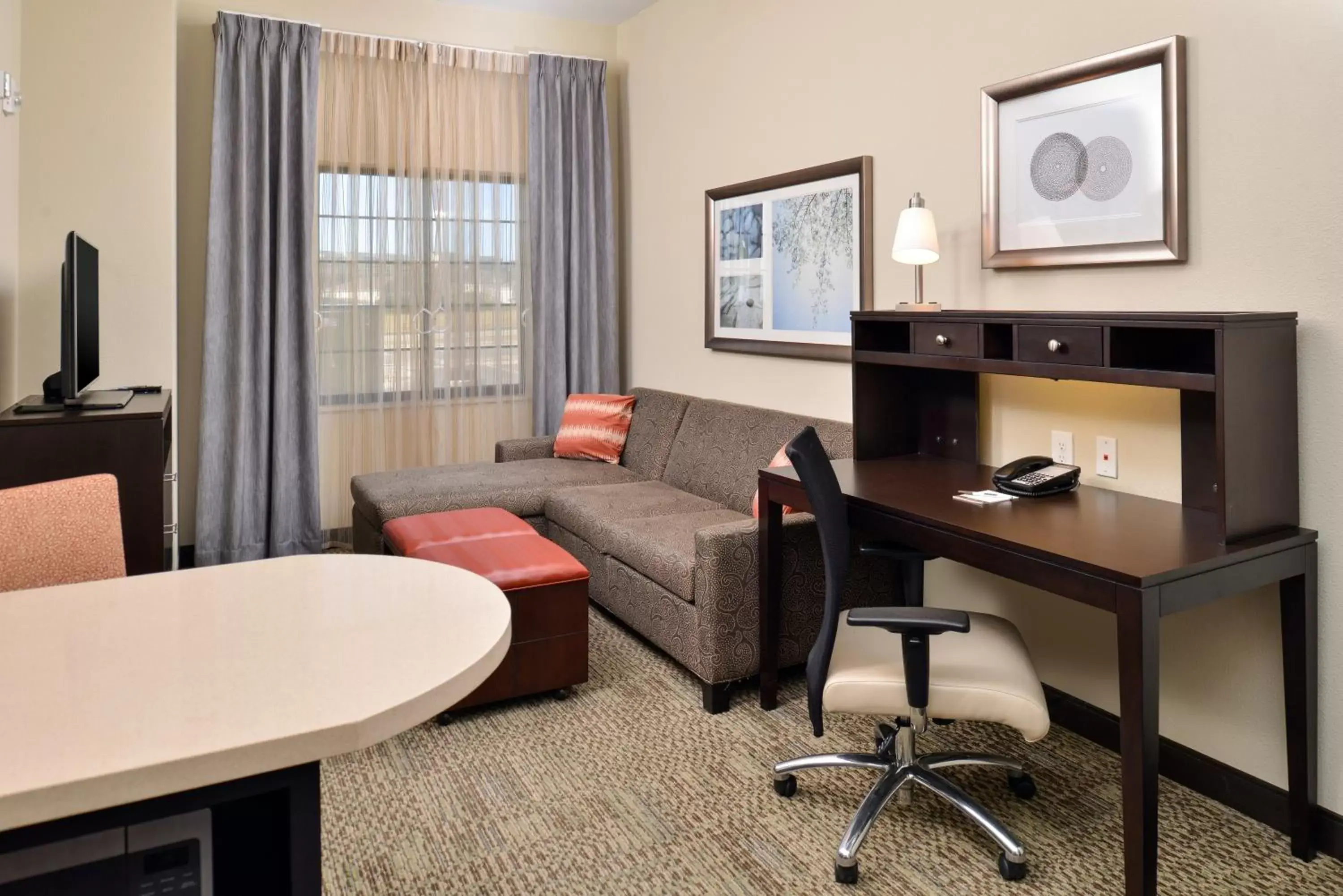 Photo of the whole room, Seating Area in Staybridge Suites Rochester, an IHG Hotel