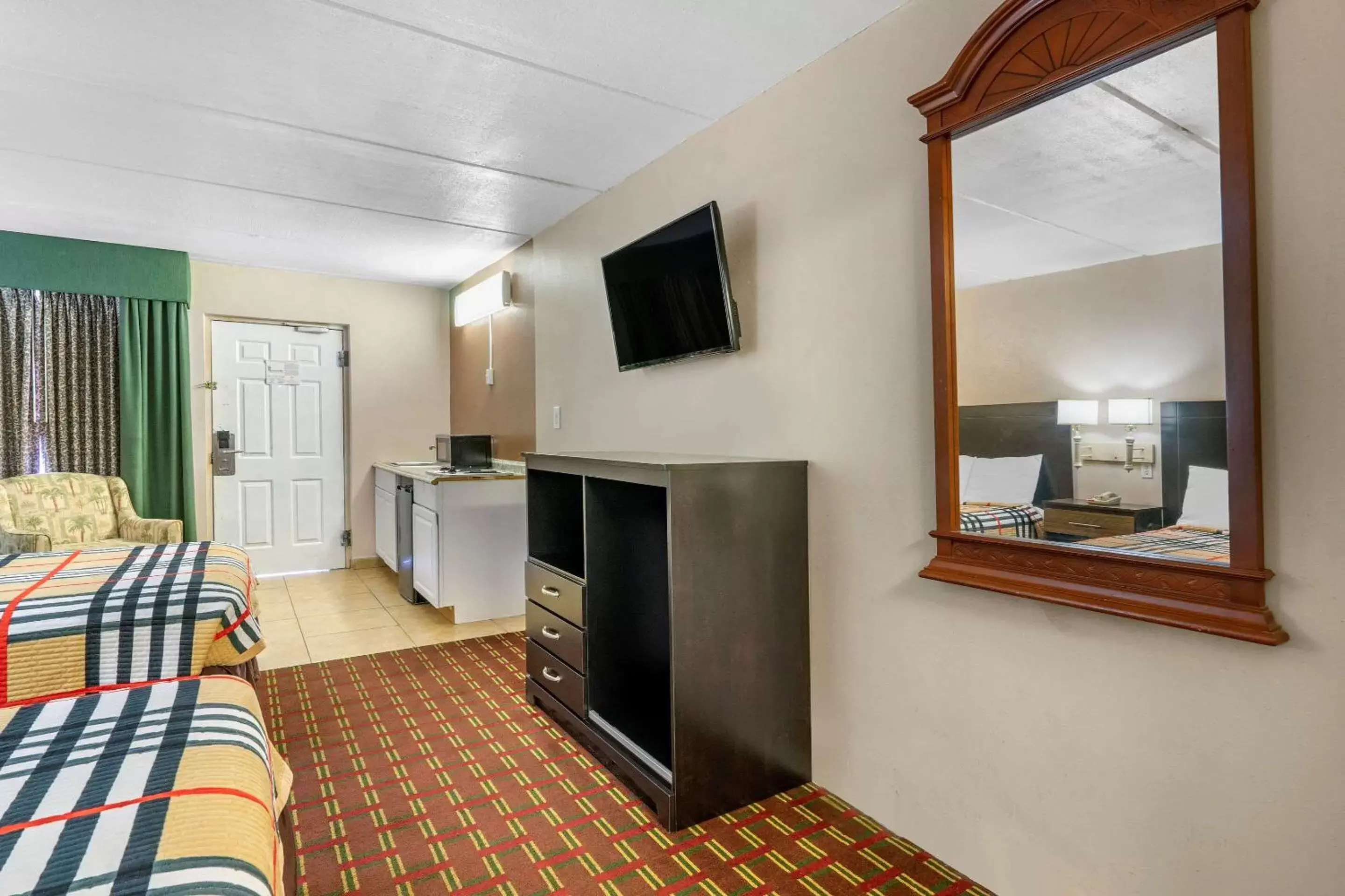 Photo of the whole room, TV/Entertainment Center in Rodeway Inn Clearwater-Dunedin