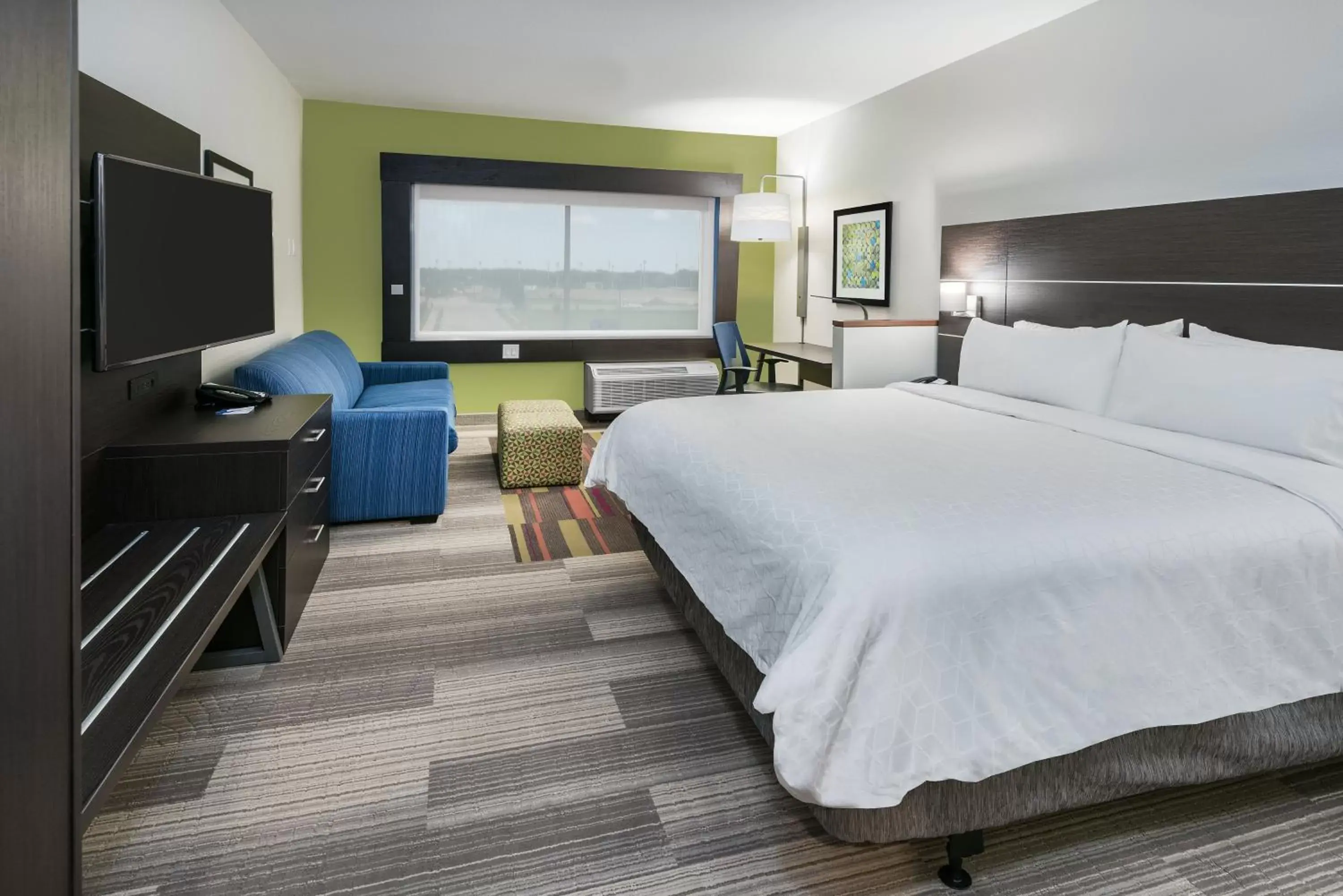 Bedroom in Holiday Inn Express & Suites Bryan - College Station, an IHG Hotel