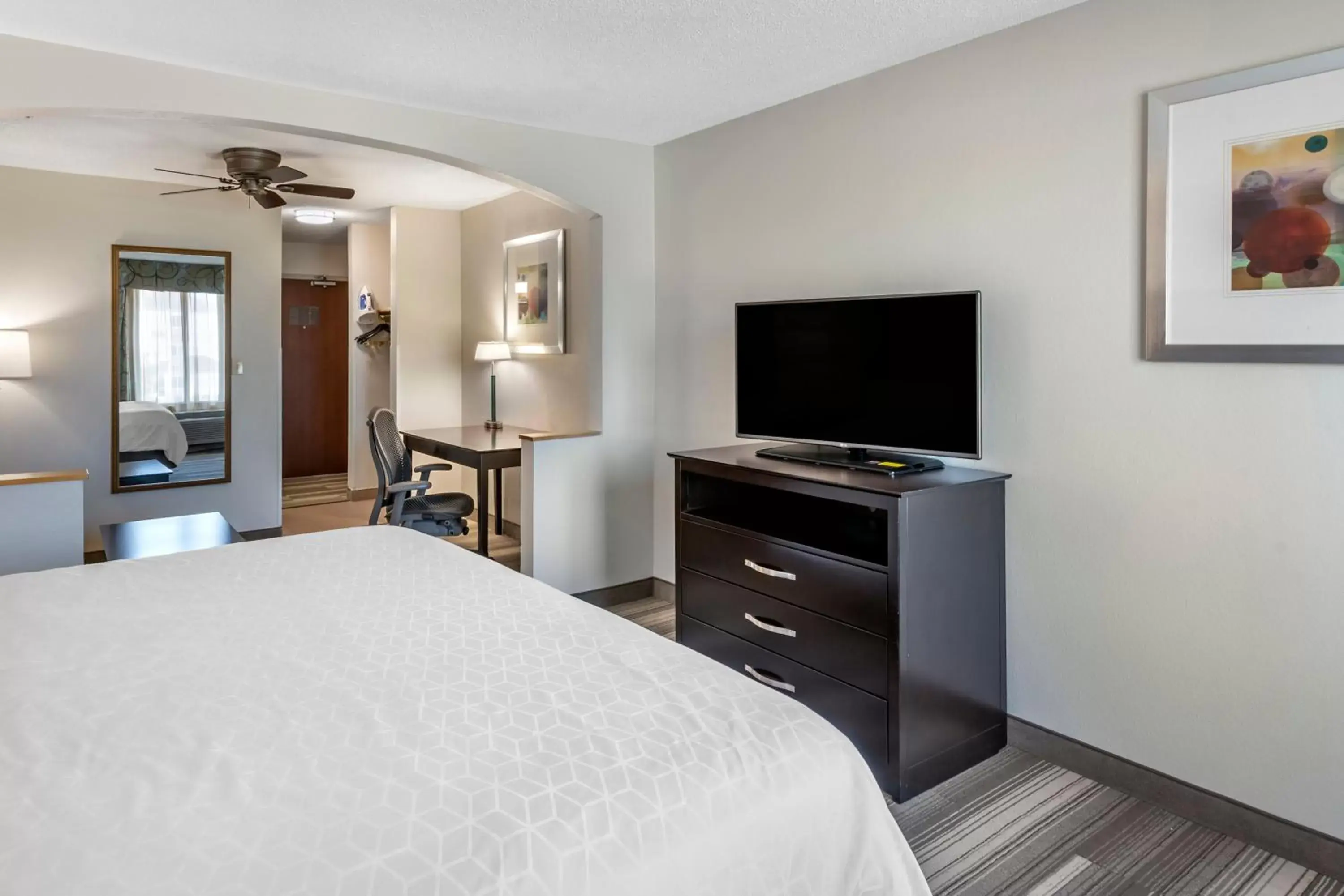 Photo of the whole room, TV/Entertainment Center in Holiday Inn Express Hotel & Suites Cincinnati-Blue Ash, an IHG Hotel