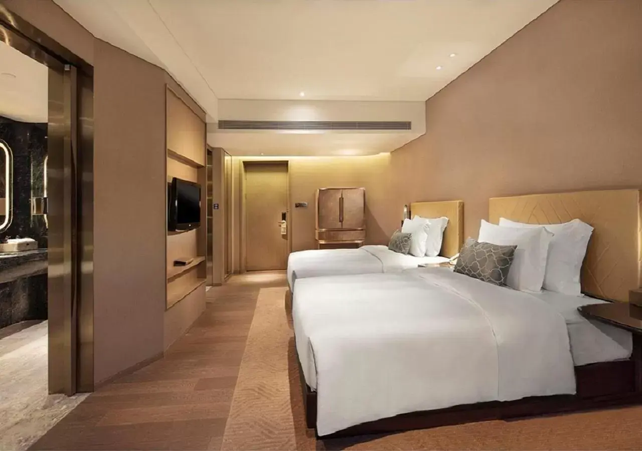 Bed in Grand Bay Hotel Zhuhai