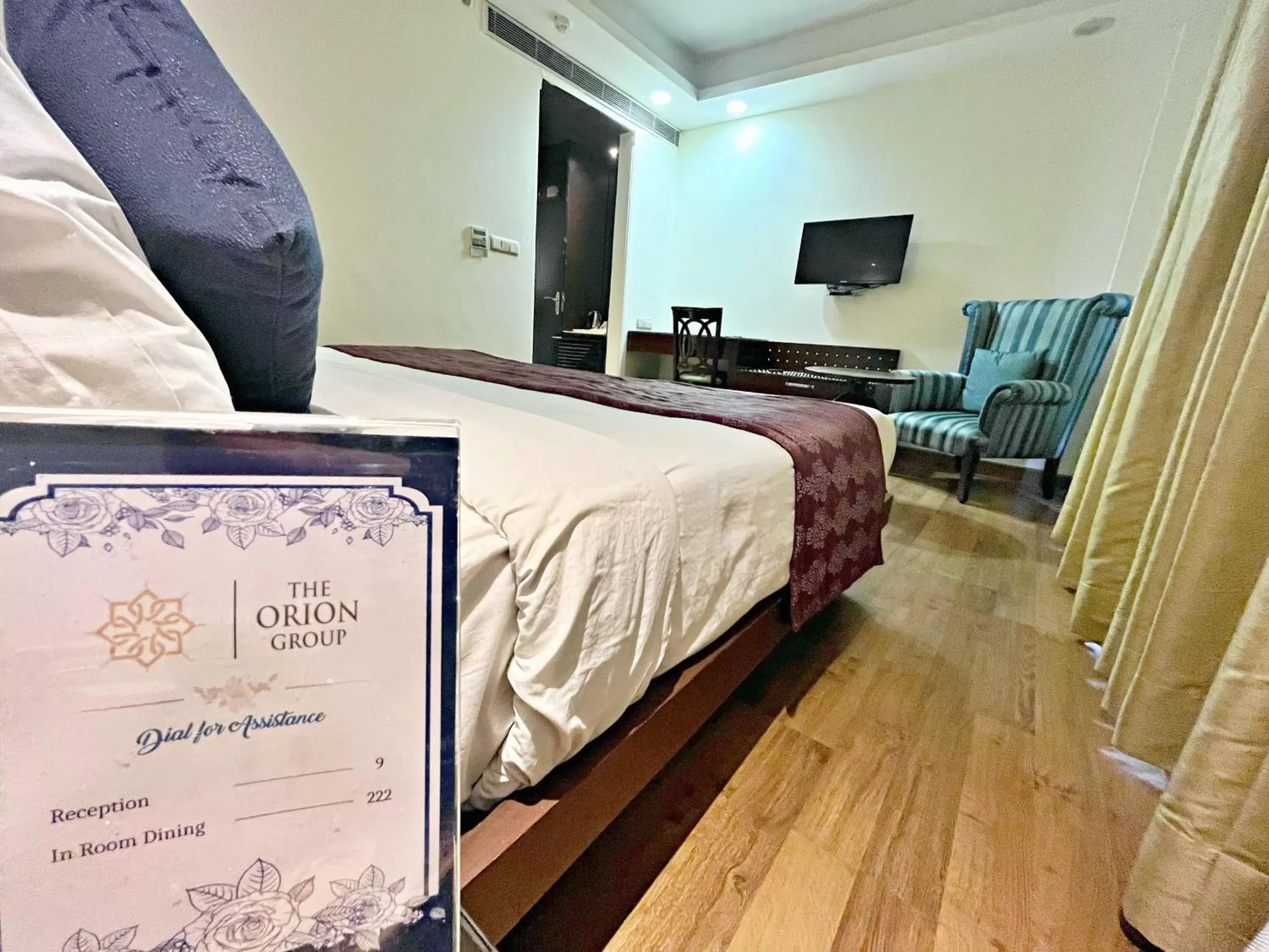 Bed in The Grand Orion - Kailash Colony