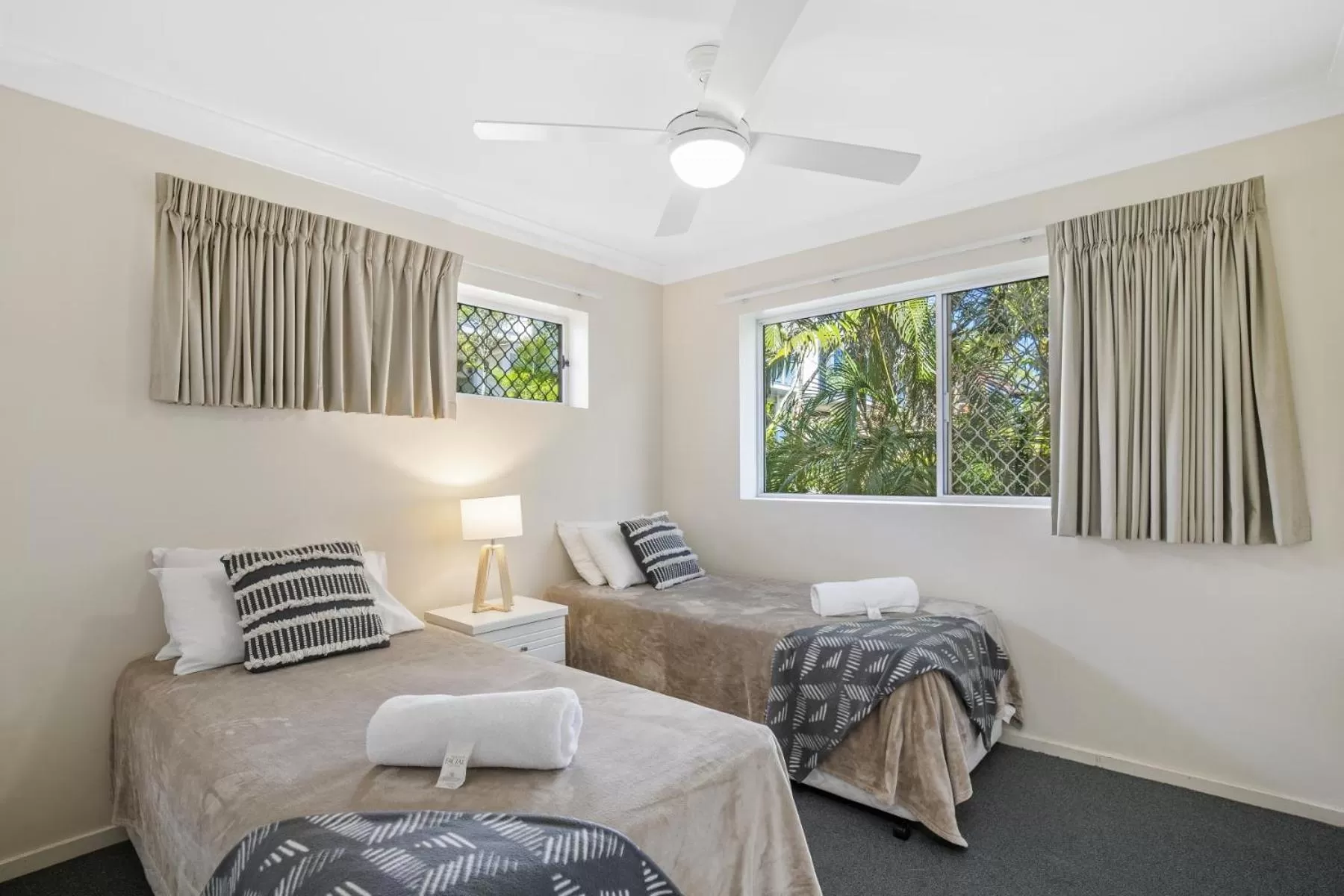Bed in Kirra Palms Holiday Apartments