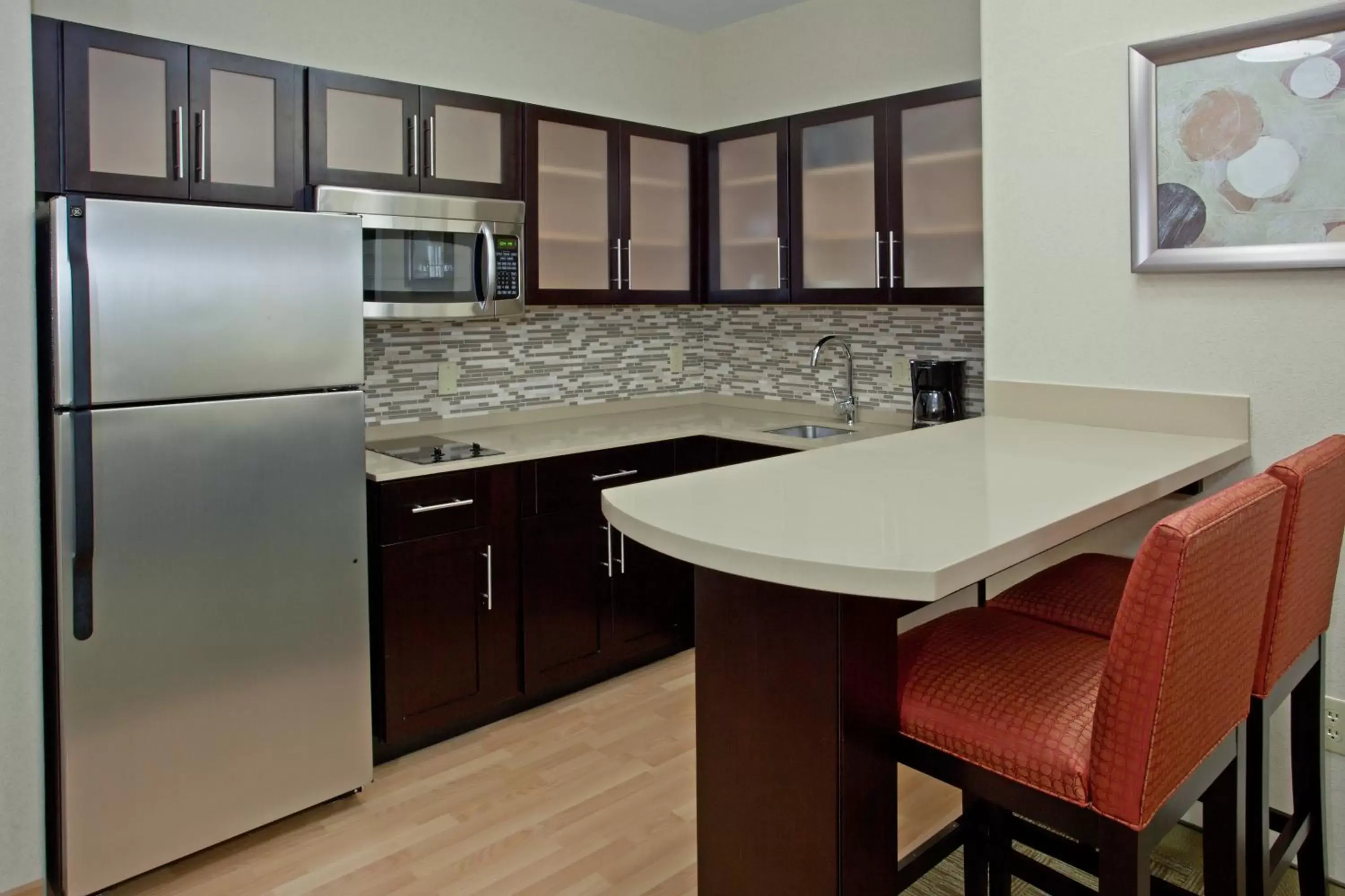 Photo of the whole room, Kitchen/Kitchenette in Staybridge Suites Houston Stafford - Sugar Land, an IHG Hotel