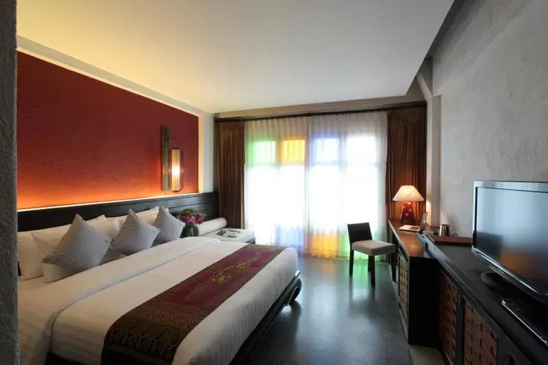Bed in De Lanna Hotel