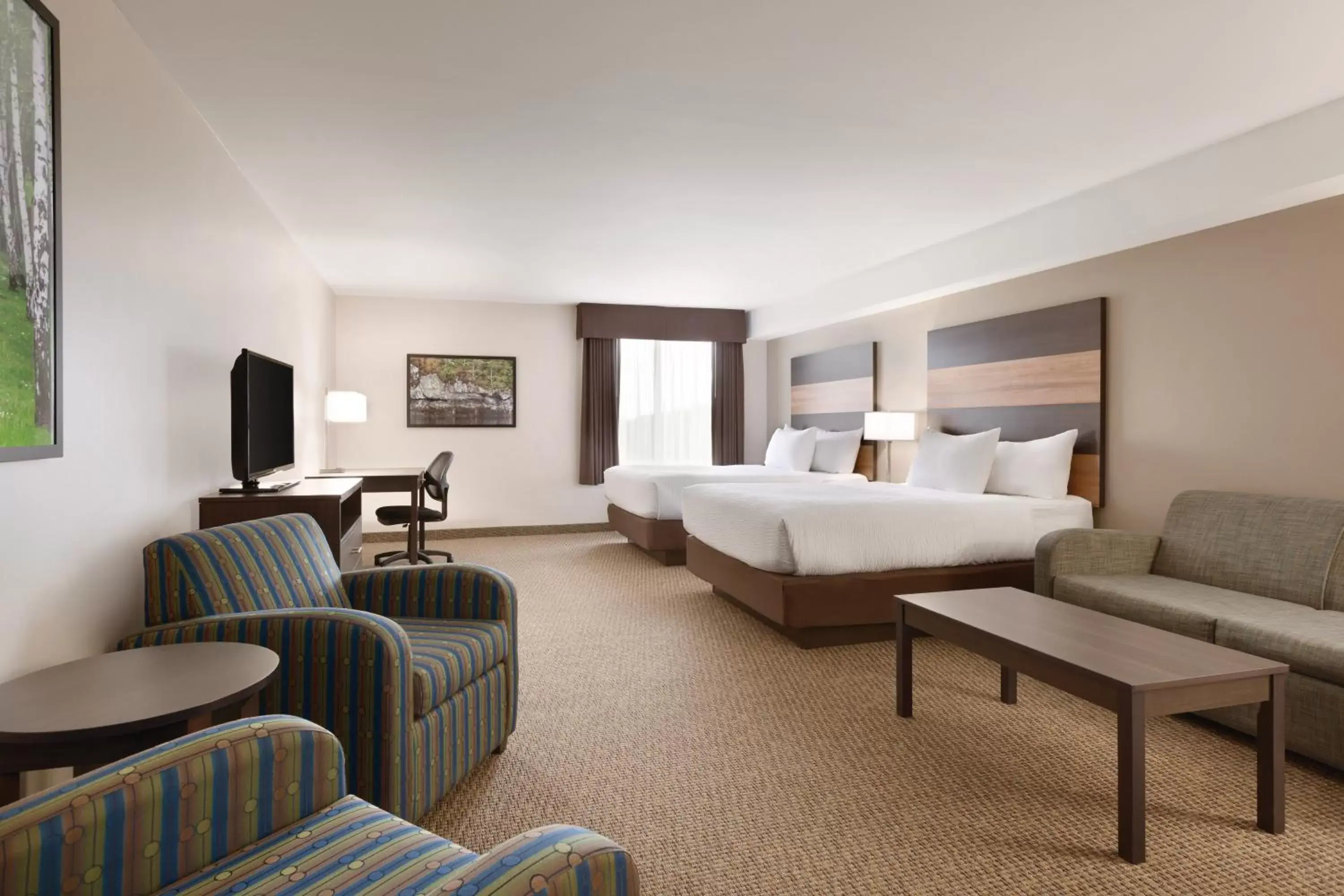 Bedroom, Seating Area in Days Inn & Suites by Wyndham Lindsay