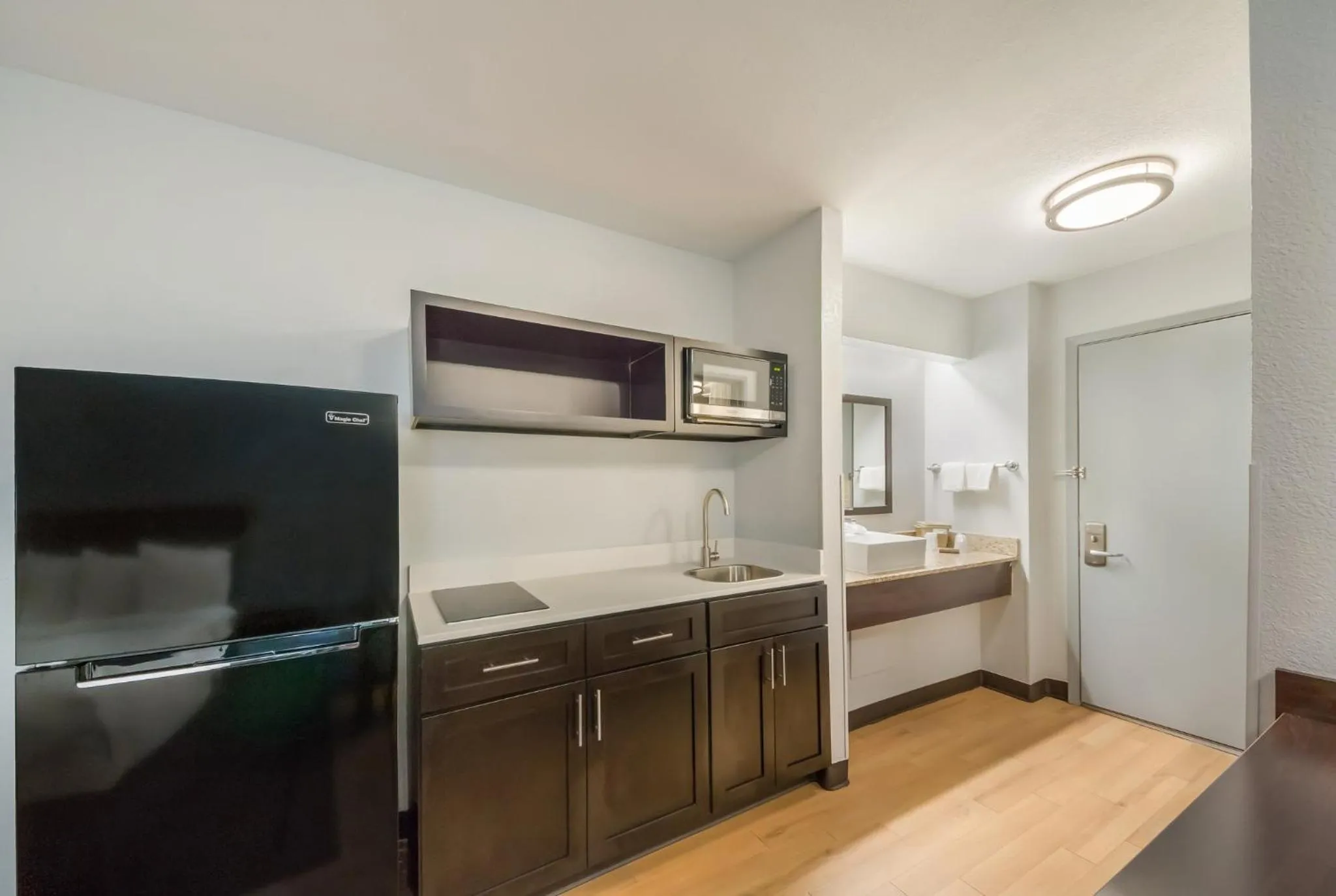 Bedroom in HomeTowne Studios by Red Roof San Antonio - SeaWorld Northwest