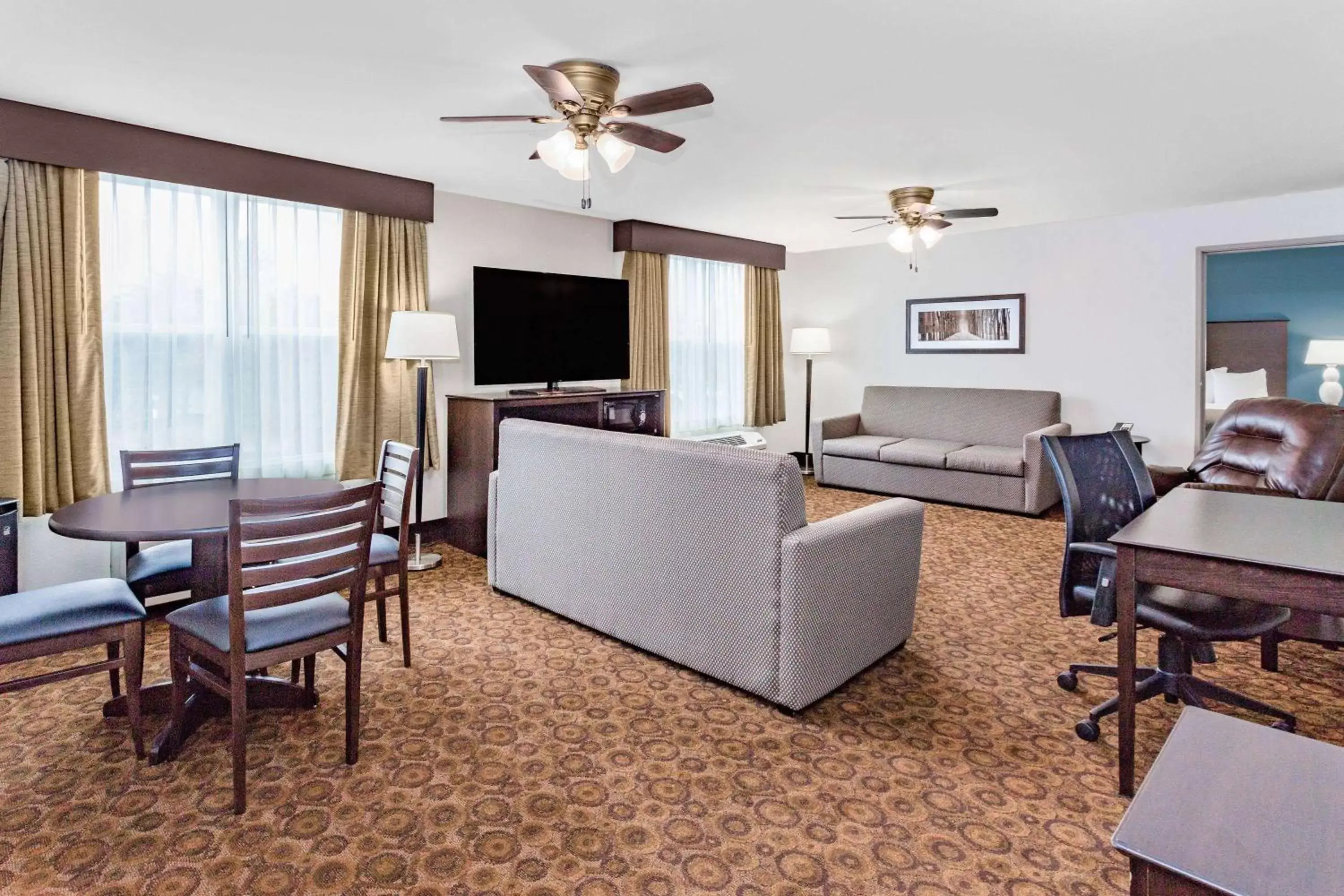 Living room, Seating Area in AmericInn by Wyndham Burnsville