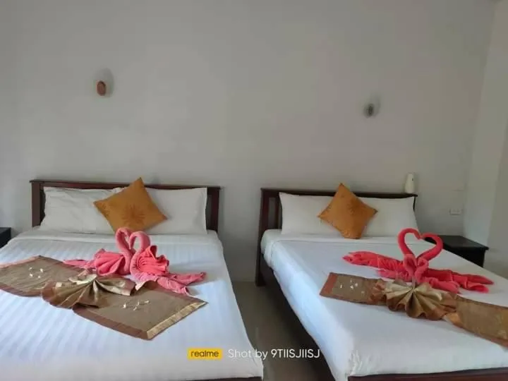 Bed in Tamarind Twin Resort