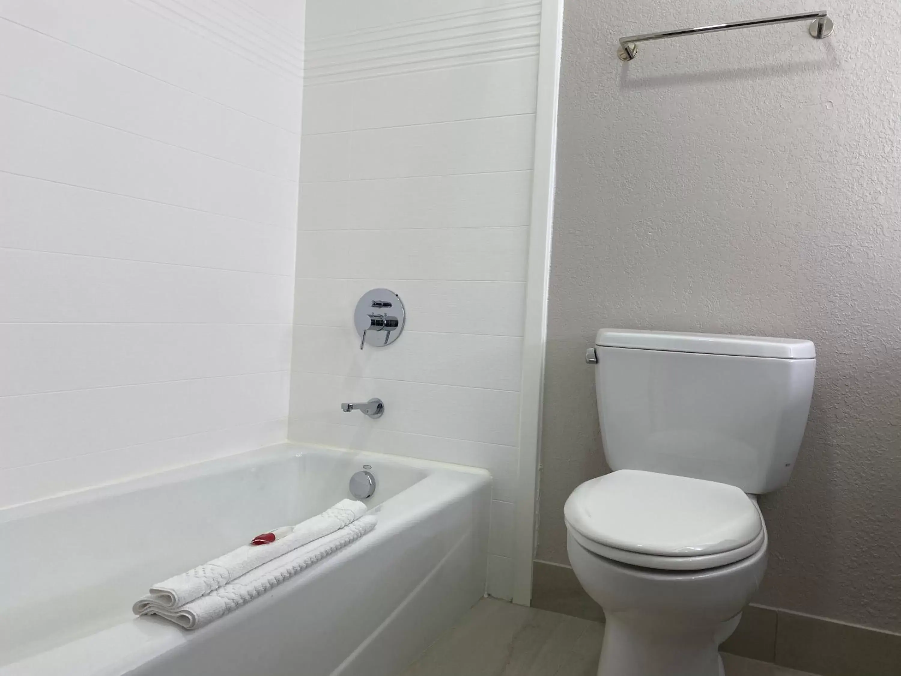 Toilet, Bathroom in Days Inn & Suites by Wyndham Peachtree Corners Norcross