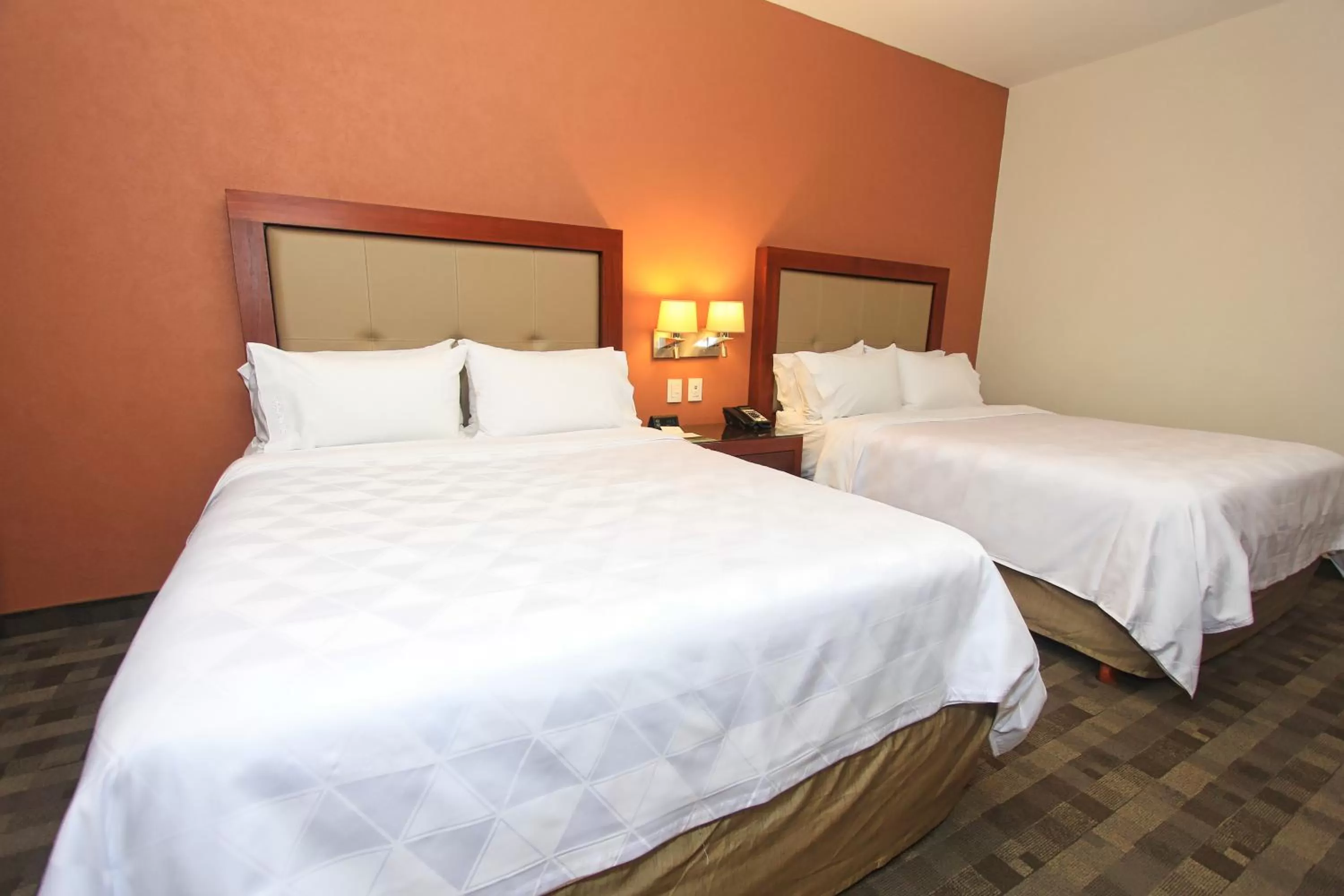 Bed in Holiday Inn & Suites Plaza Mayor by IHG