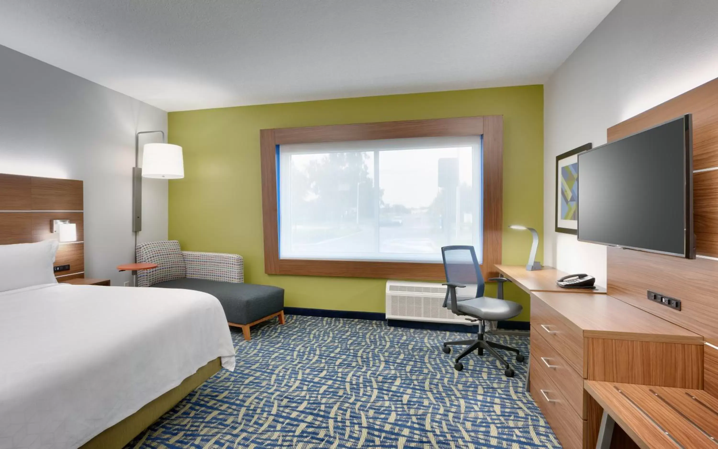 Photo of the whole room, TV/Entertainment Center in Holiday Inn Express & Suites - Gainesville I-75, an IHG Hotel