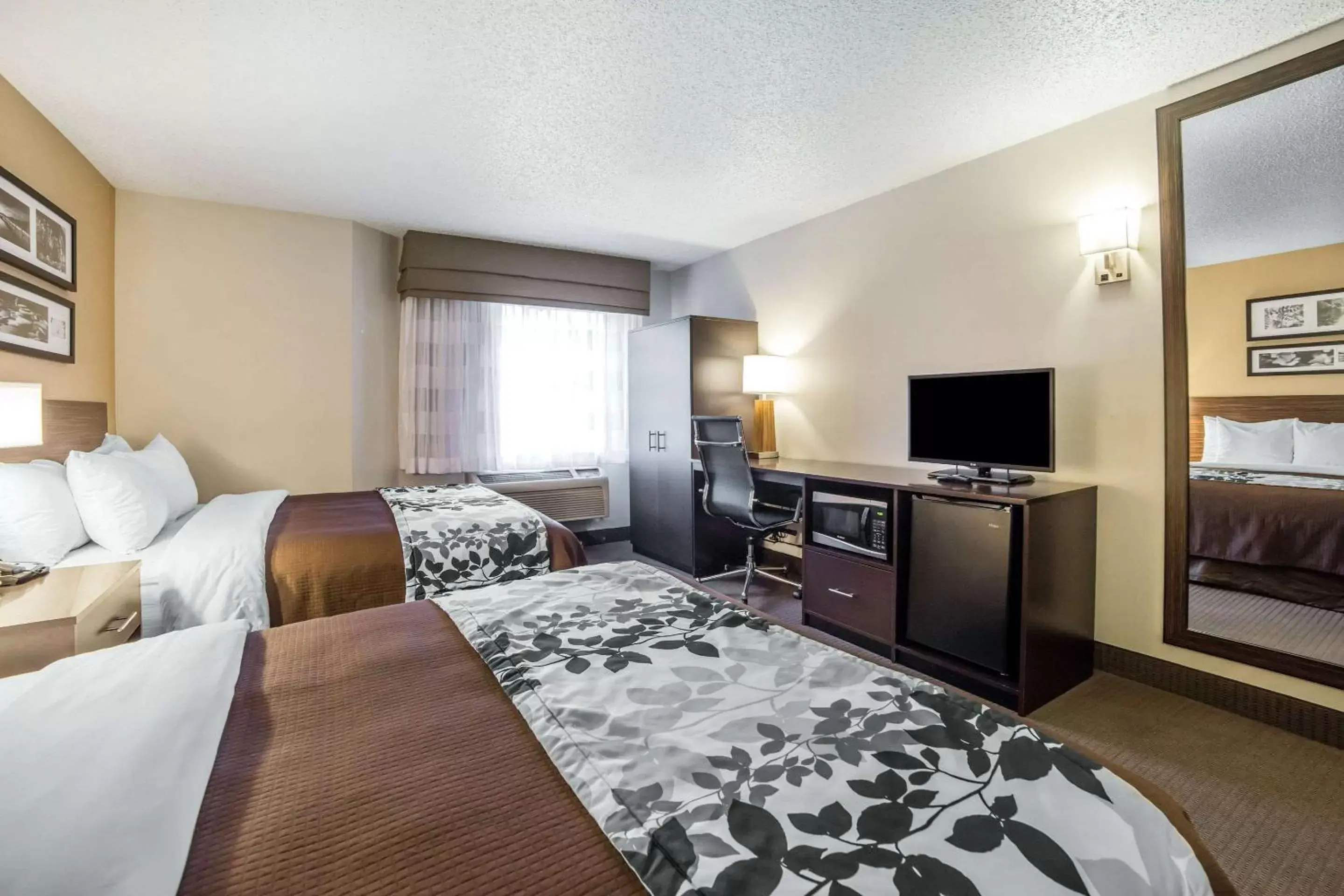 Photo of the whole room, TV/Entertainment Center in Sleep Inn Provo near University