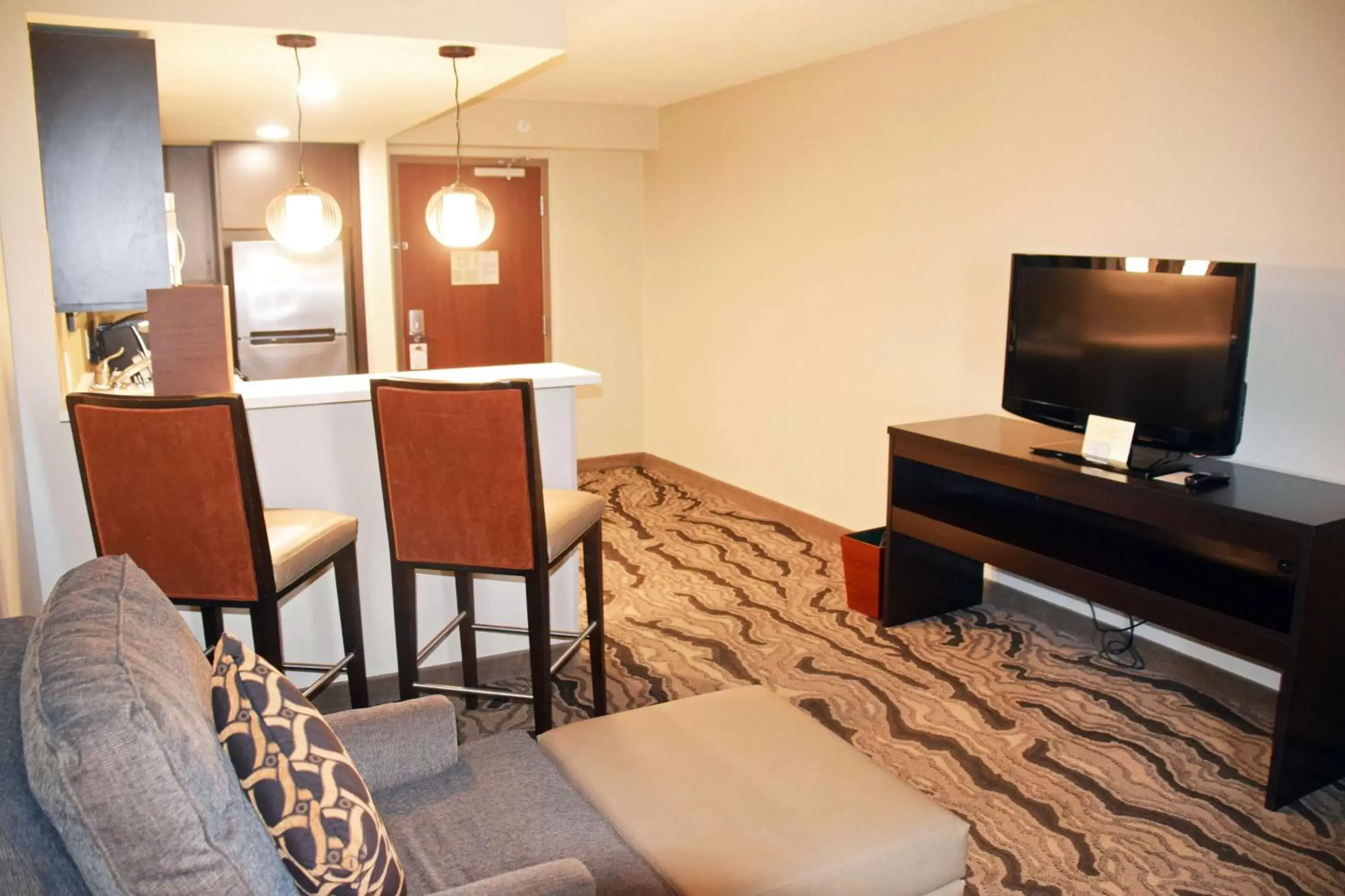 Living room, TV/Entertainment Center in DoubleTree by Hilton Montgomery Downtown