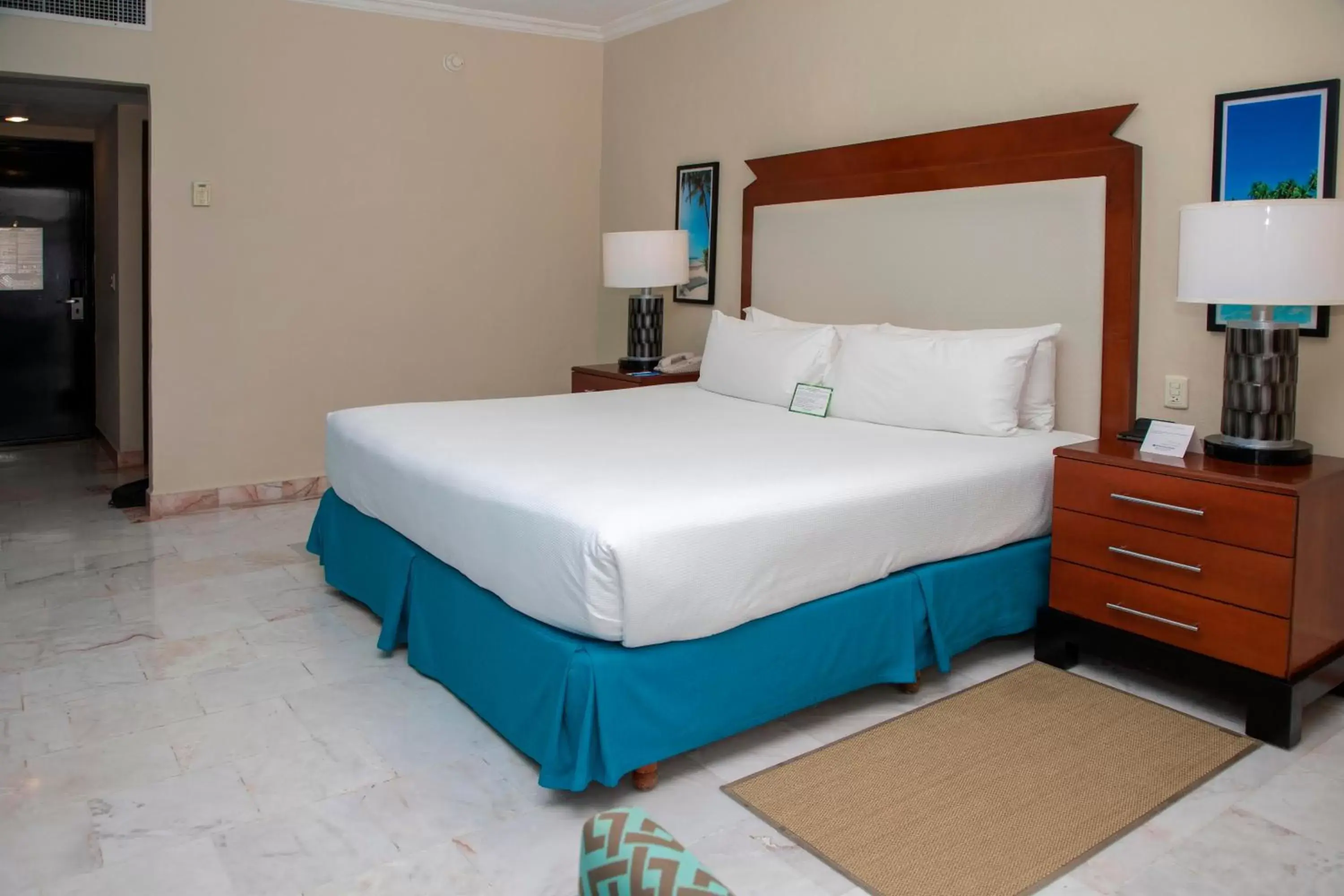 Bed in Wyndham Grand Cancun All Inclusive Resort & Villas