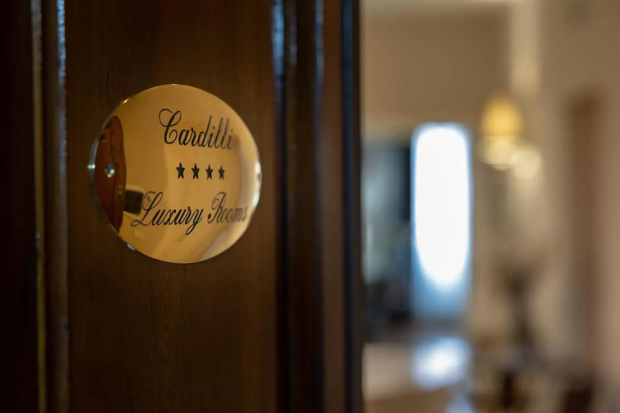 Logo/Certificate/Sign in Cardilli Luxury Rooms