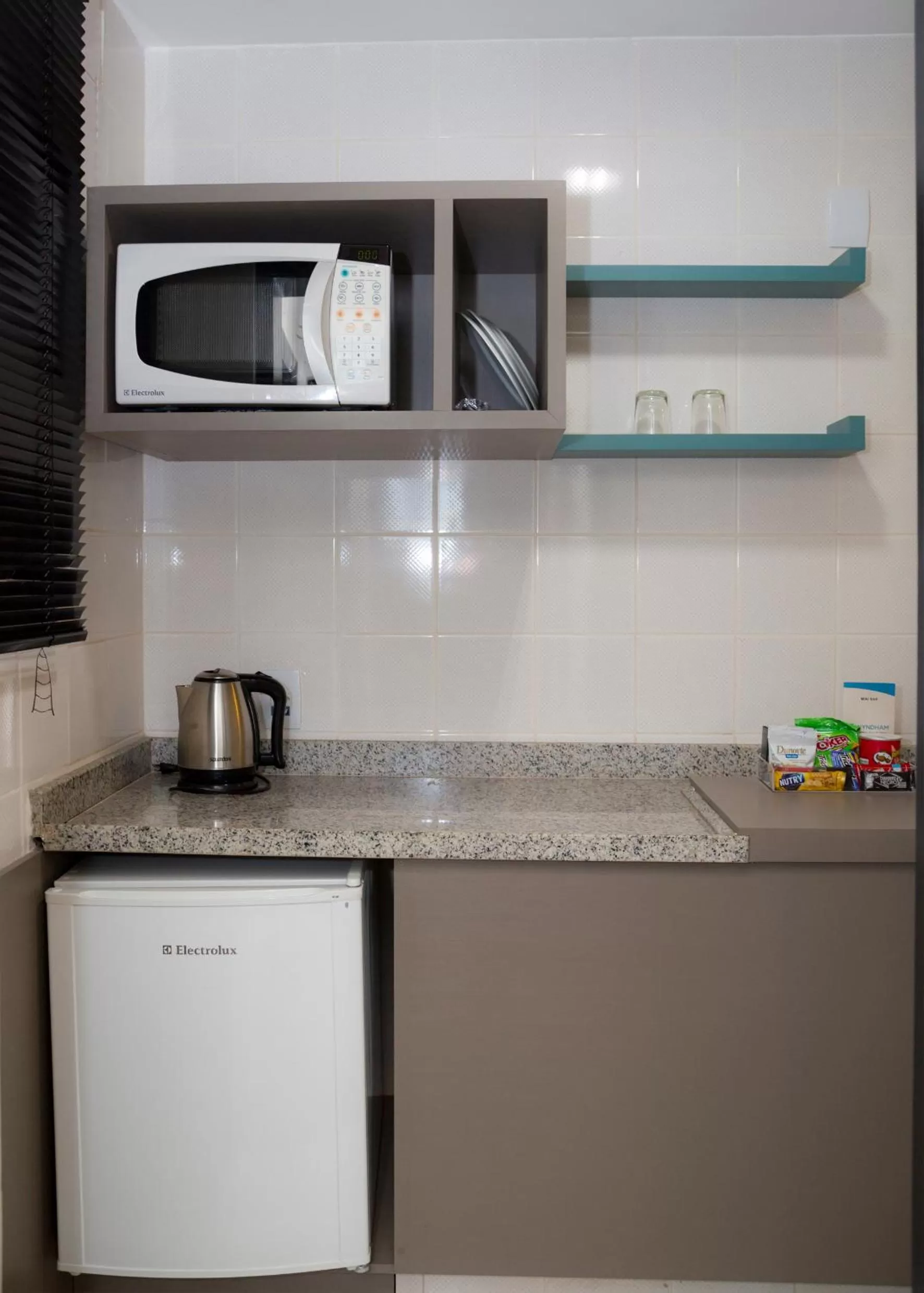 Kitchen or kitchenette in Wyndham Golden Foz Suítes
