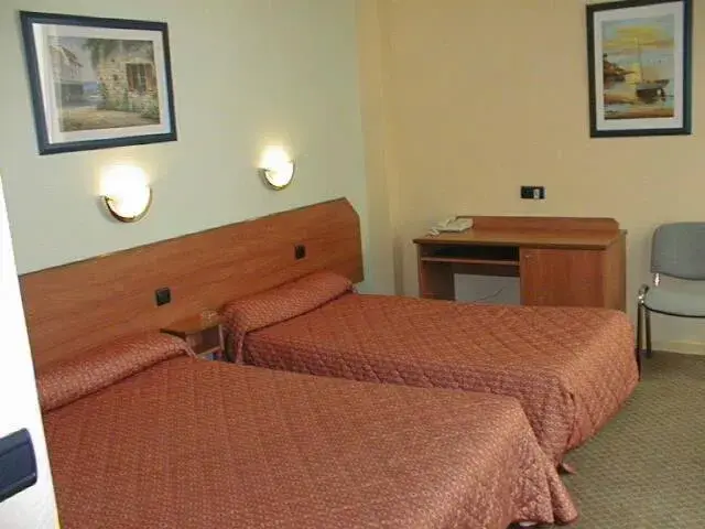 Bed in Hotel Ferney République