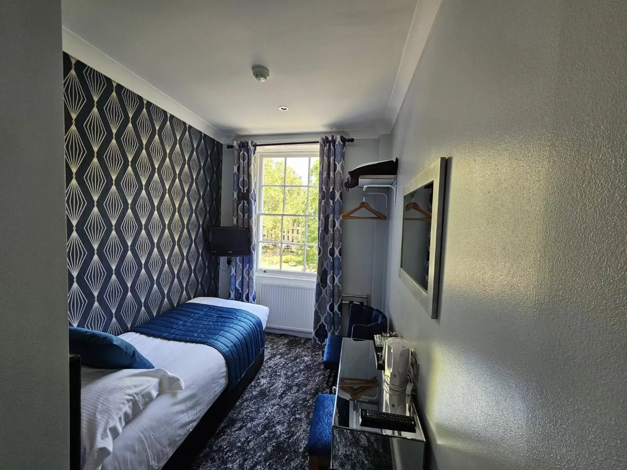 Bedroom in Mentone Hotel