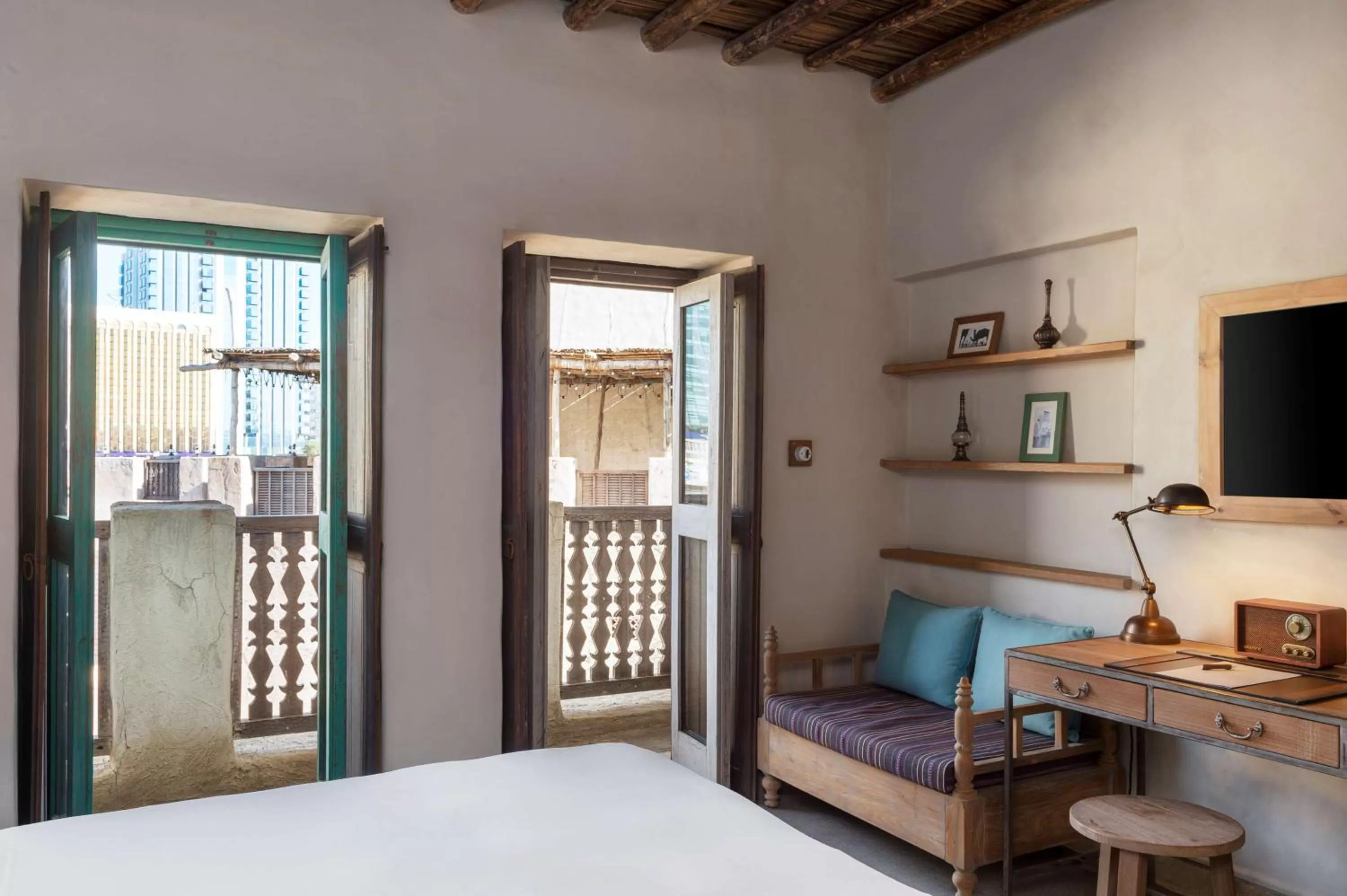 Living room, Bed in Al Seef Heritage Hotel Dubai, Curio Collection by Hilton