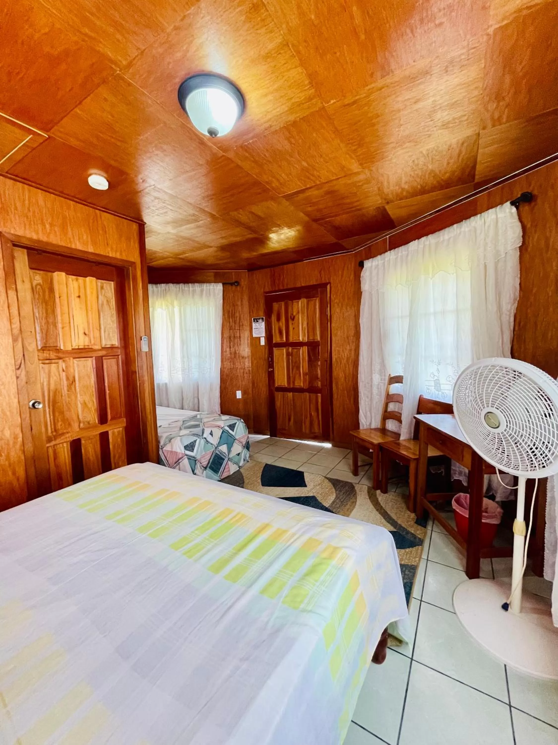 Bed in Lamanai Riverside Retreat