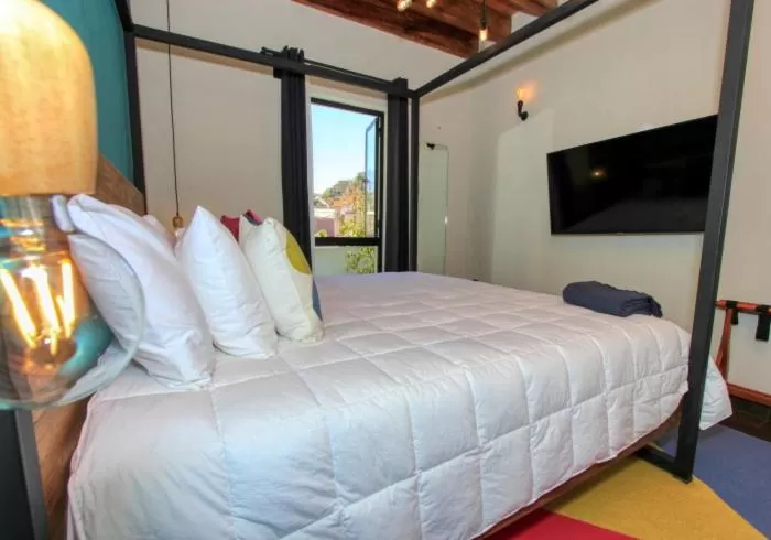 Bed in Antigua Trece Hotel Fusión