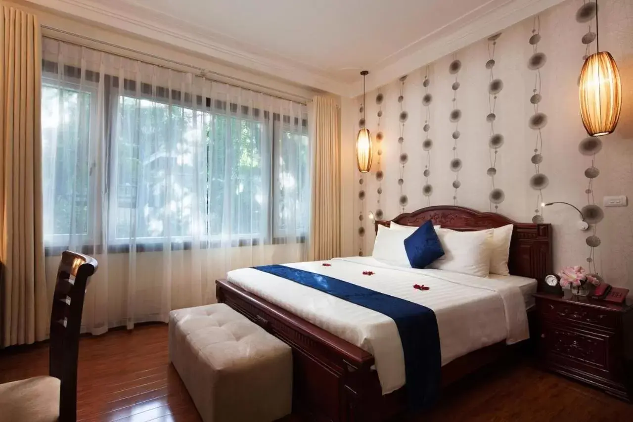 Bed in Hanoi Golden Moon Hotel