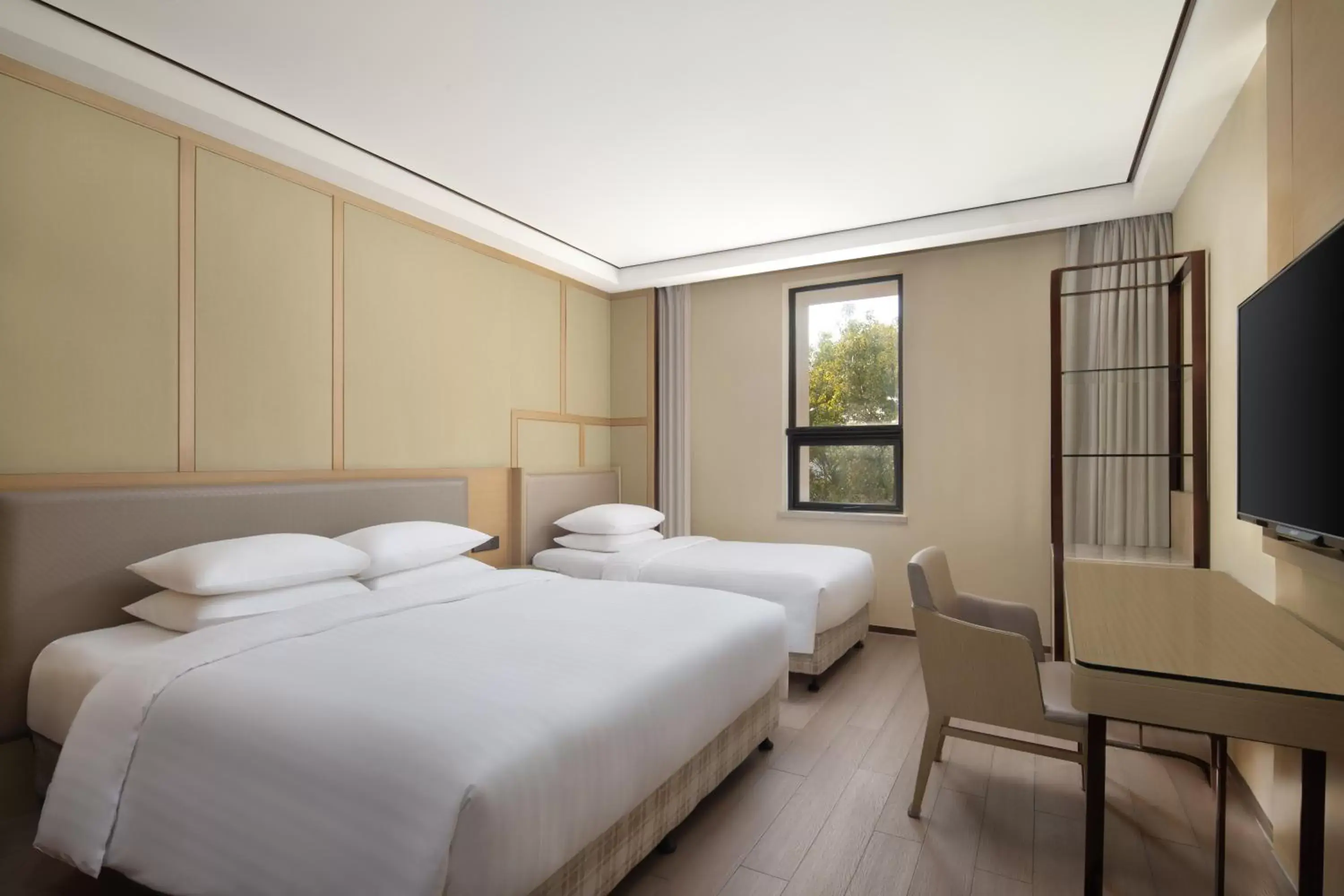 Bed in Courtyard by Marriott Shanghai International Tourism and Resorts Zone